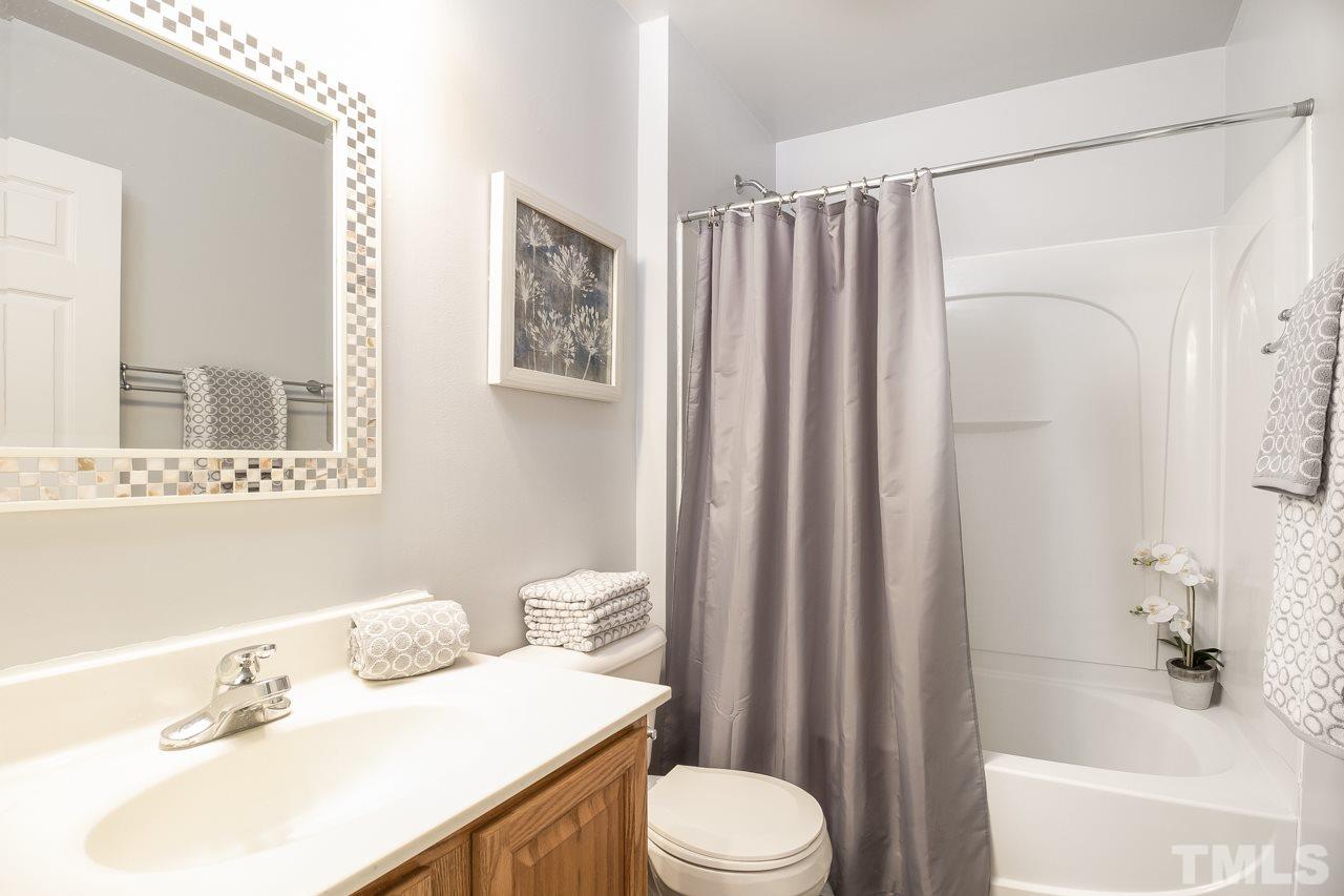 11701 Coppergate Drive, Unit 105 Raleigh, NC 27614 - Photo 17 of 25 The second floor hall bathroom features tile floors, a tub/shower and a single vanity topped with cultured marble. Updated lighting, mirror and towel bars complete this bath.