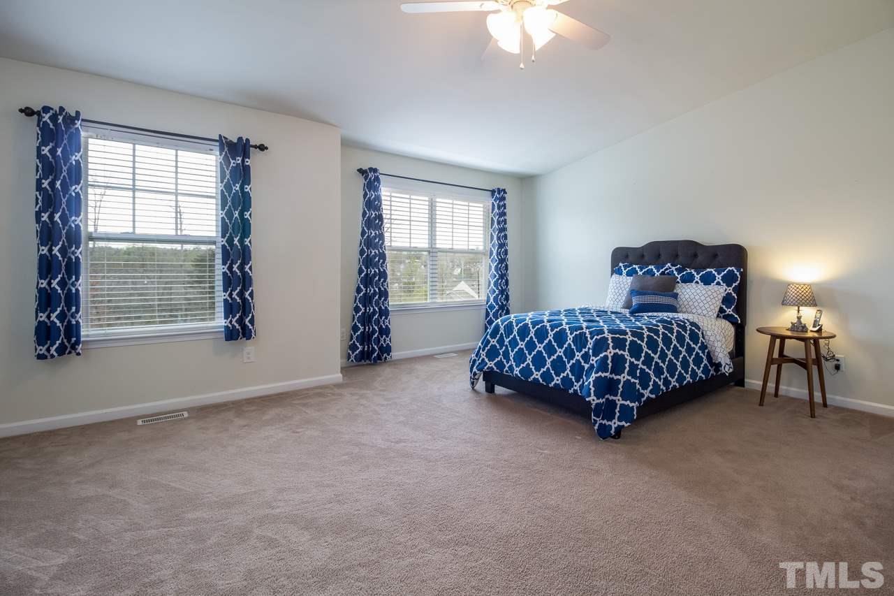 11701 Coppergate Drive, Unit 105 Raleigh, NC 27614 - Photo 19 of 25 The third floor is entirely devoted to the master suite. This room is huge! Two windows provide plenty of light.