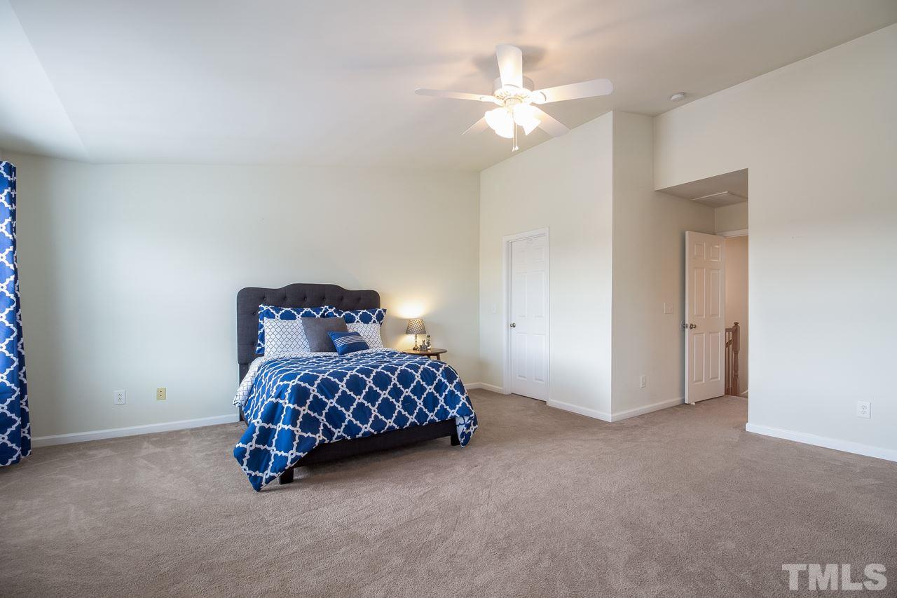 11701 Coppergate Drive, Unit 105 Raleigh, NC 27614 - Photo 20 of 25 A ceiling fan and large walk-in closet complete the room.