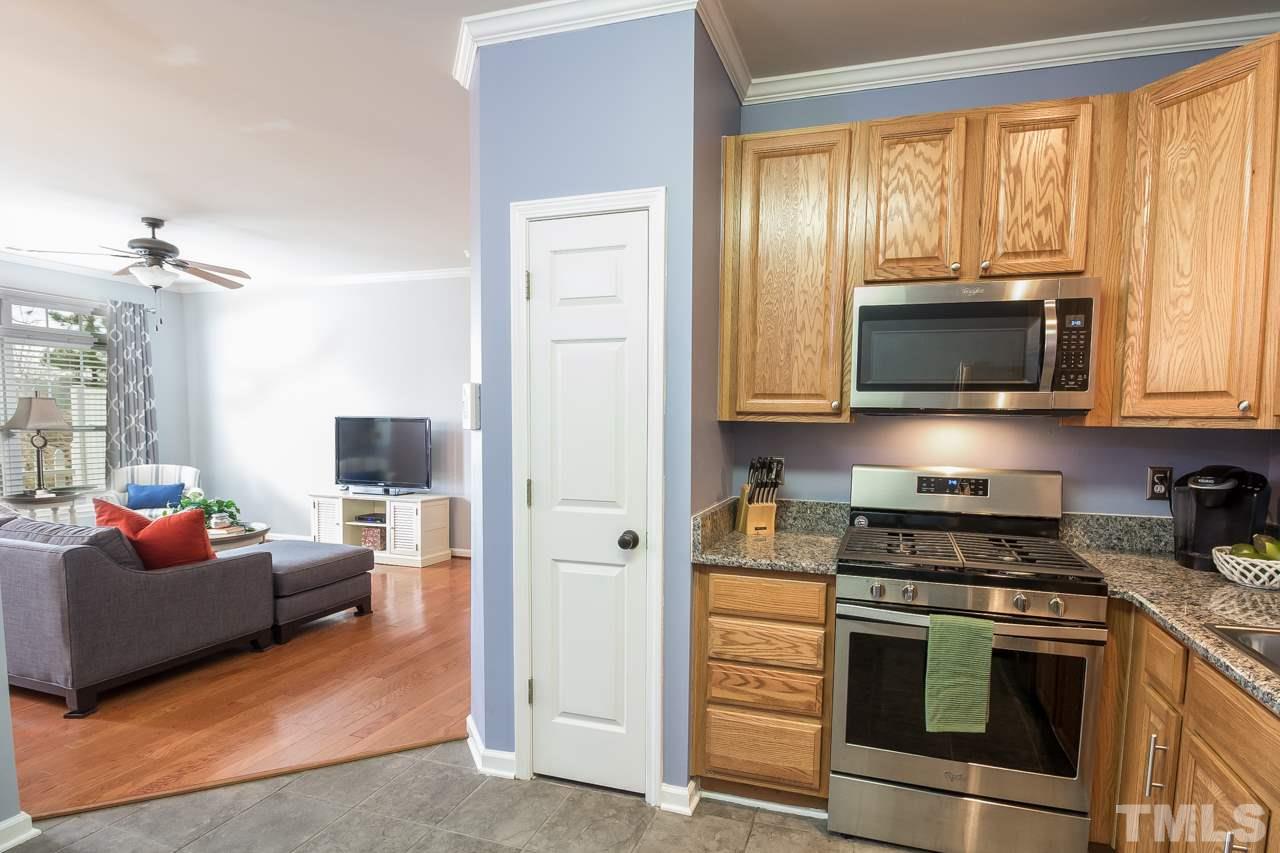 11701 Coppergate Drive, Unit 105 Raleigh, NC 27614 - Photo 10 of 25 The chef in the family will love this gas range. The door to the left is a pantry.