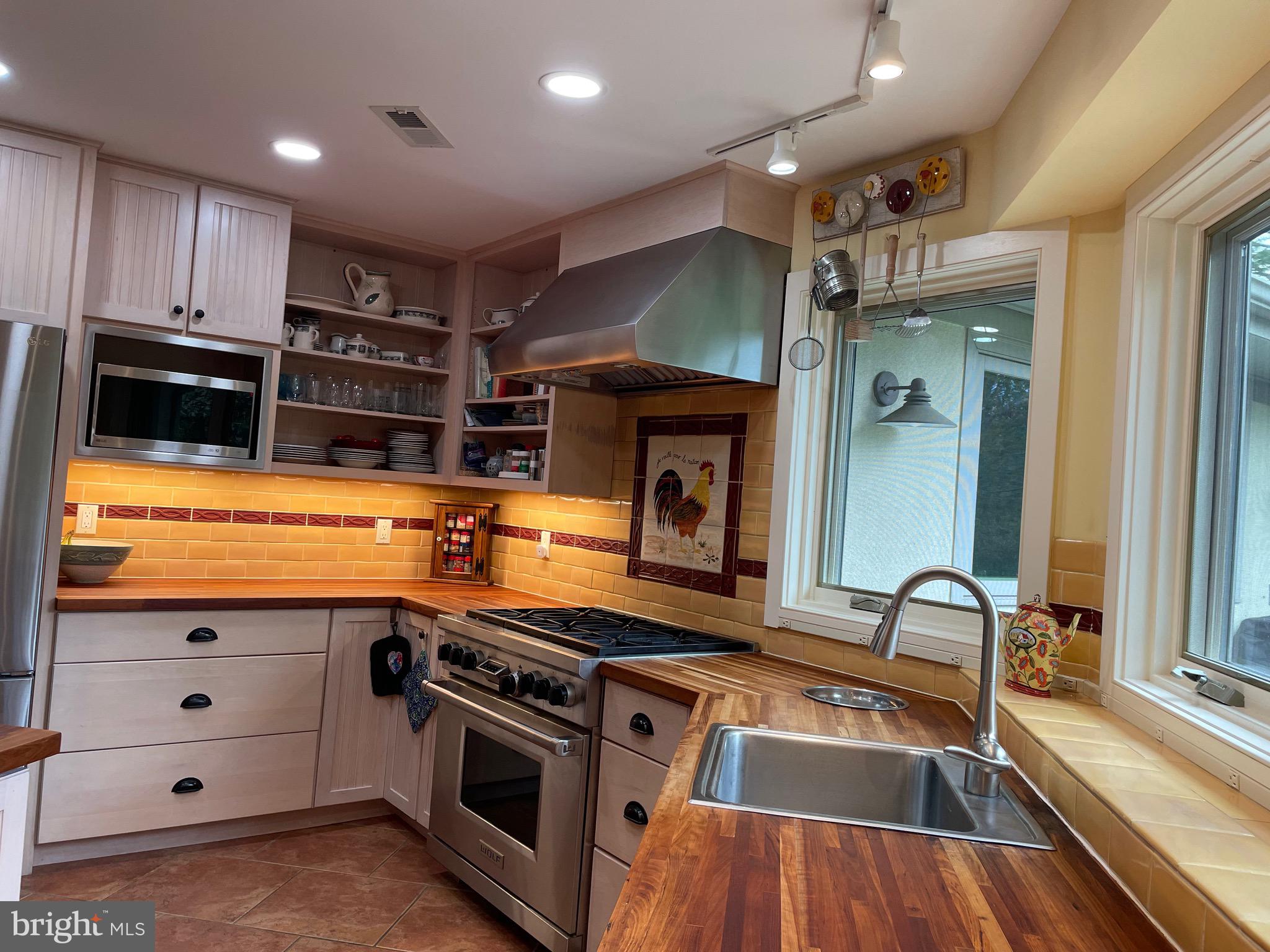 821 Long Mountain Road Washington, VA 22747 - Photo 9 of 24 a kitchen that has a sink a stove and cabinets