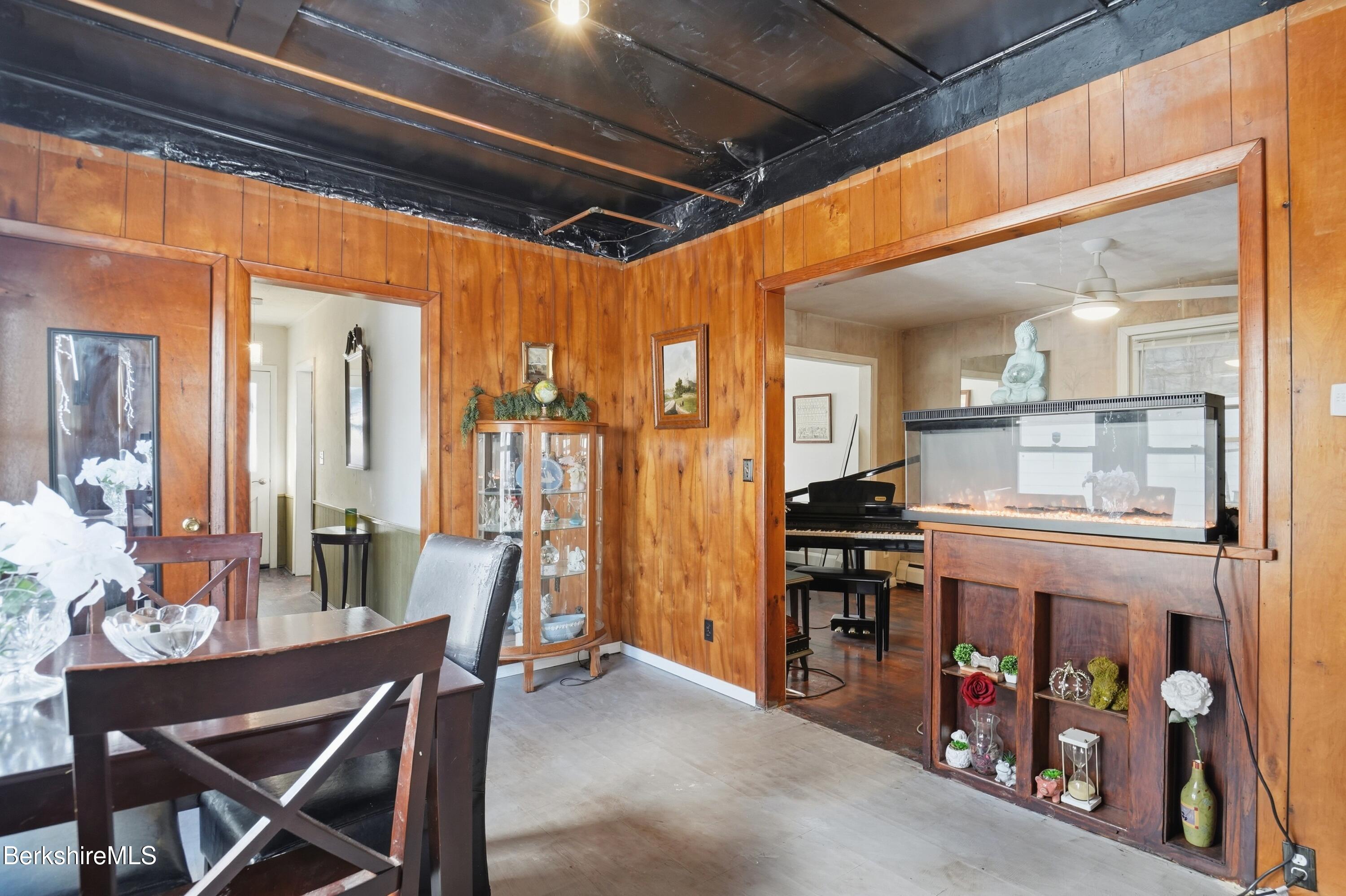 9 Lincoln Street Pittsfield, MA 01201 - Photo 15 of 44 a dining room with furniture and a chandelier