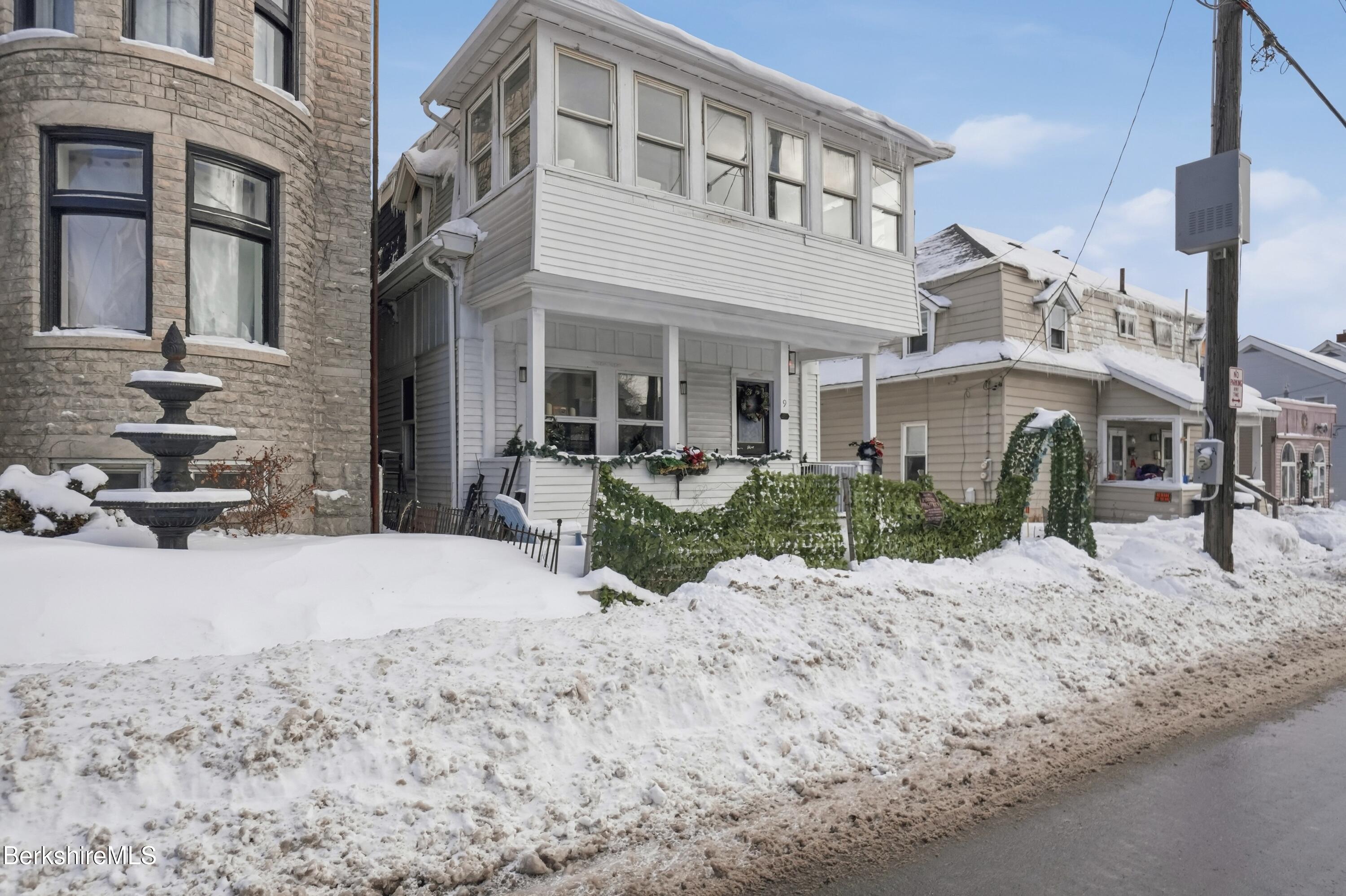 9 Lincoln Street Pittsfield, MA 01201 - Photo 2 of 44 a view of a building with a snow in front of house
