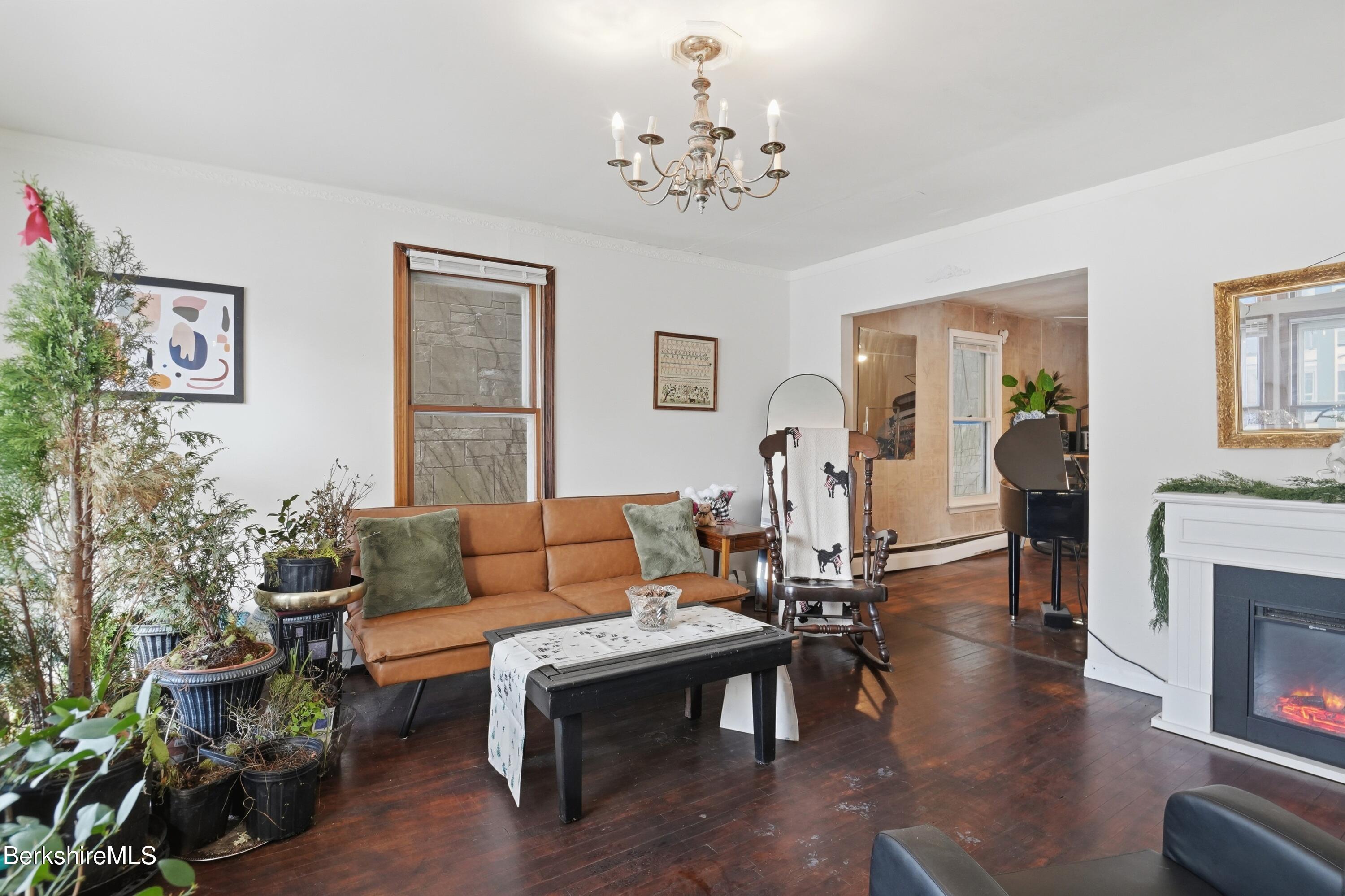 9 Lincoln Street Pittsfield, MA 01201 - Photo 22 of 44 a living room with furniture and a fireplace