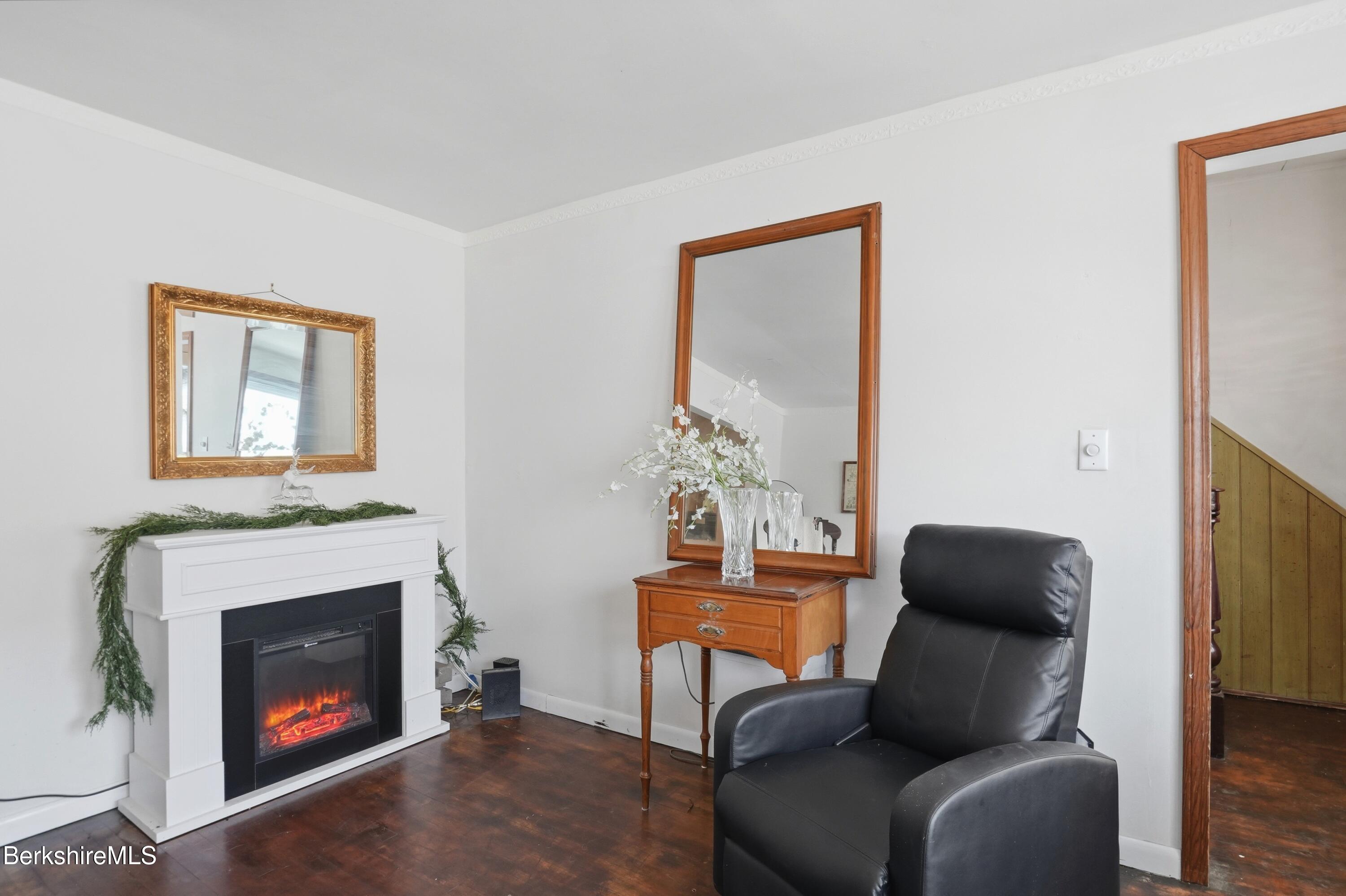 9 Lincoln Street Pittsfield, MA 01201 - Photo 23 of 44 a living room with furniture a fireplace and a window