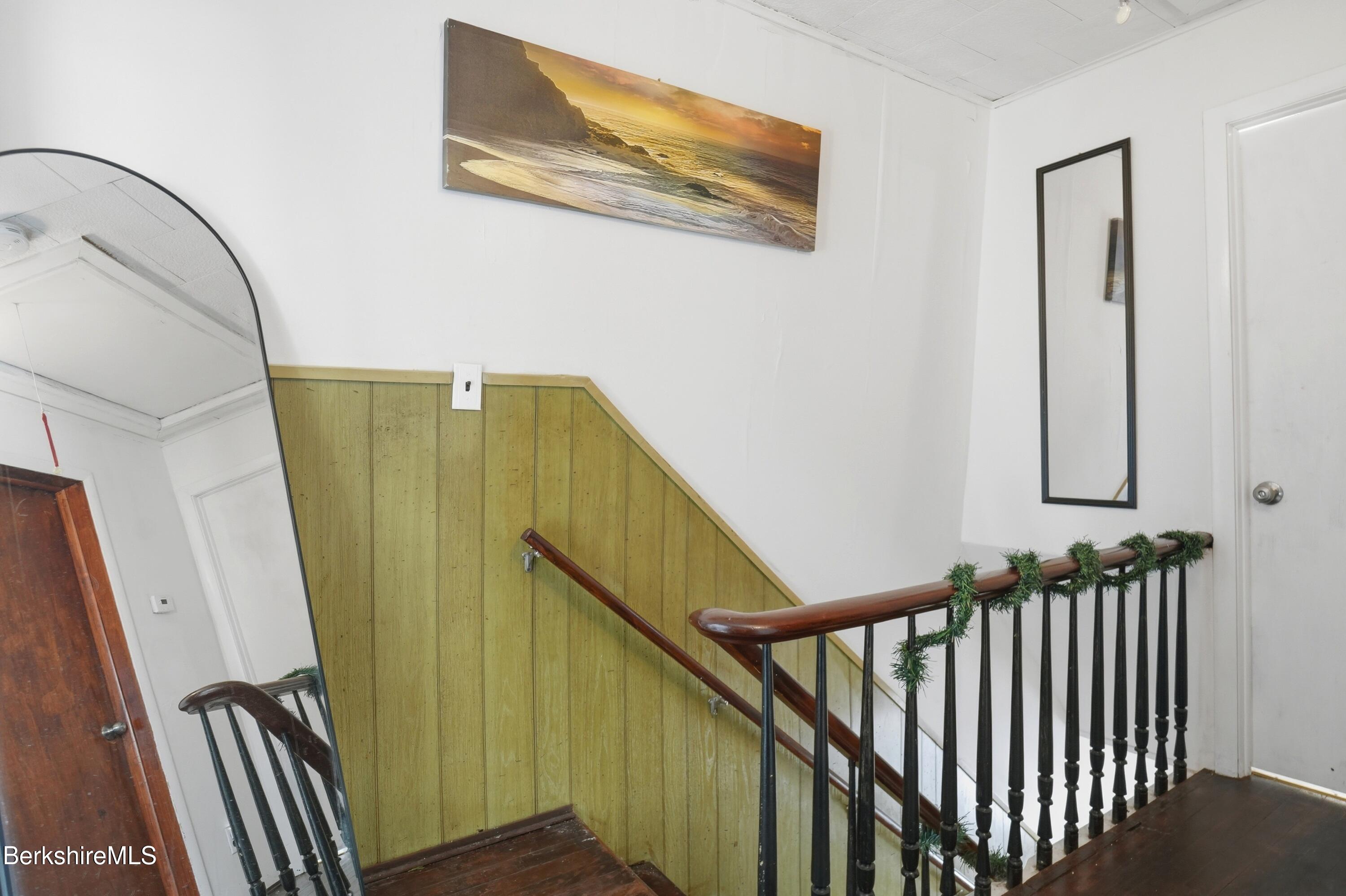 9 Lincoln Street Pittsfield, MA 01201 - Photo 25 of 44 a view of a staircase with wooden floor and stairs