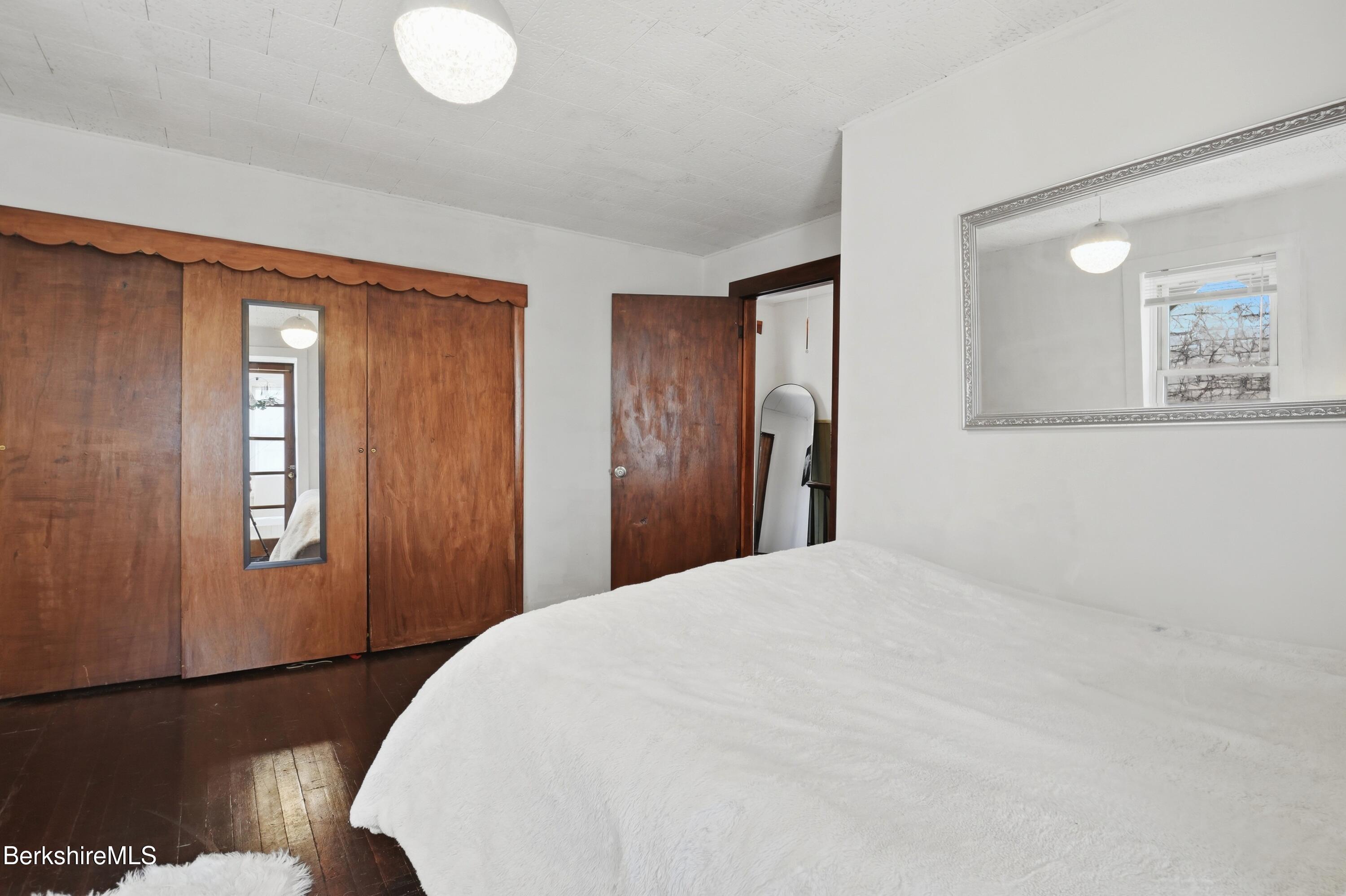 9 Lincoln Street Pittsfield, MA 01201 - Photo 26 of 44 a bedroom with a bed and a window