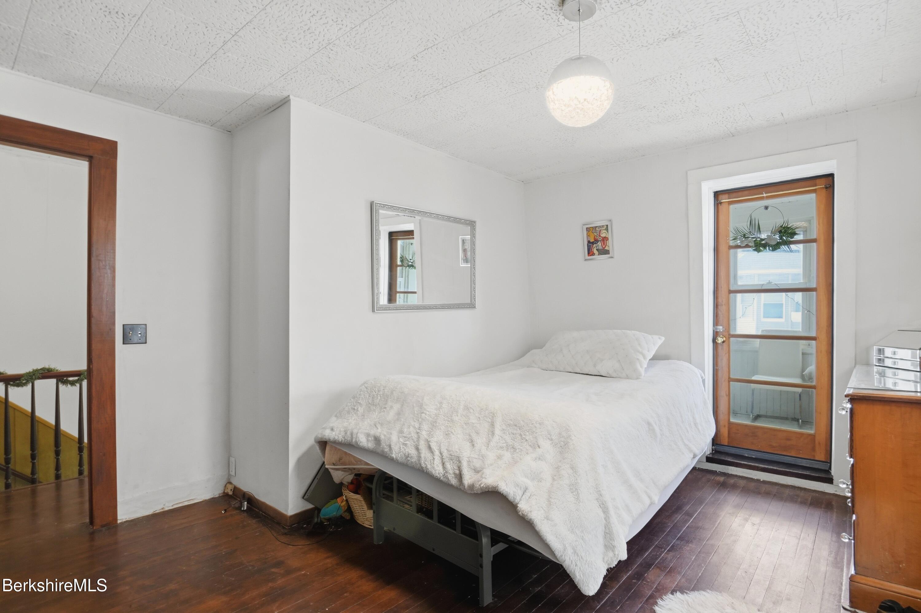 9 Lincoln Street Pittsfield, MA 01201 - Photo 27 of 44 a bedroom with a bed and a window