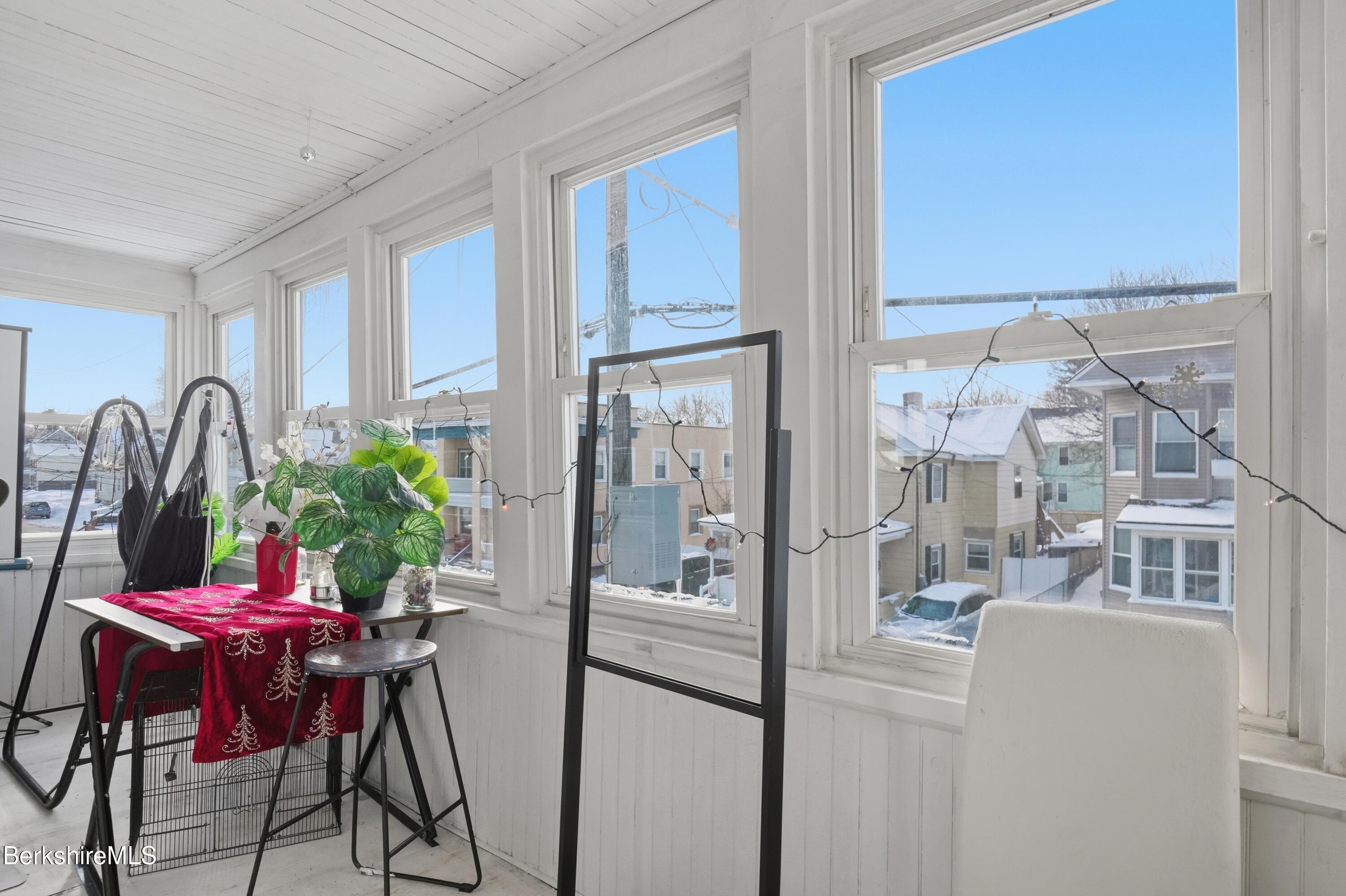 9 Lincoln Street Pittsfield, MA 01201 - Photo 29 of 44 a dining room with furniture window and wooden floor