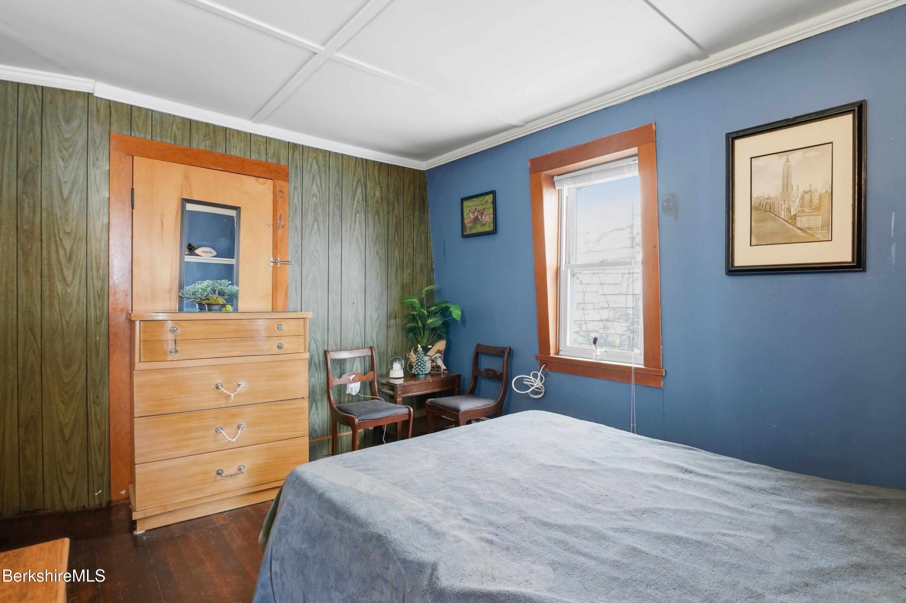 9 Lincoln Street Pittsfield, MA 01201 - Photo 34 of 44 a bedroom with a bed and a dresser