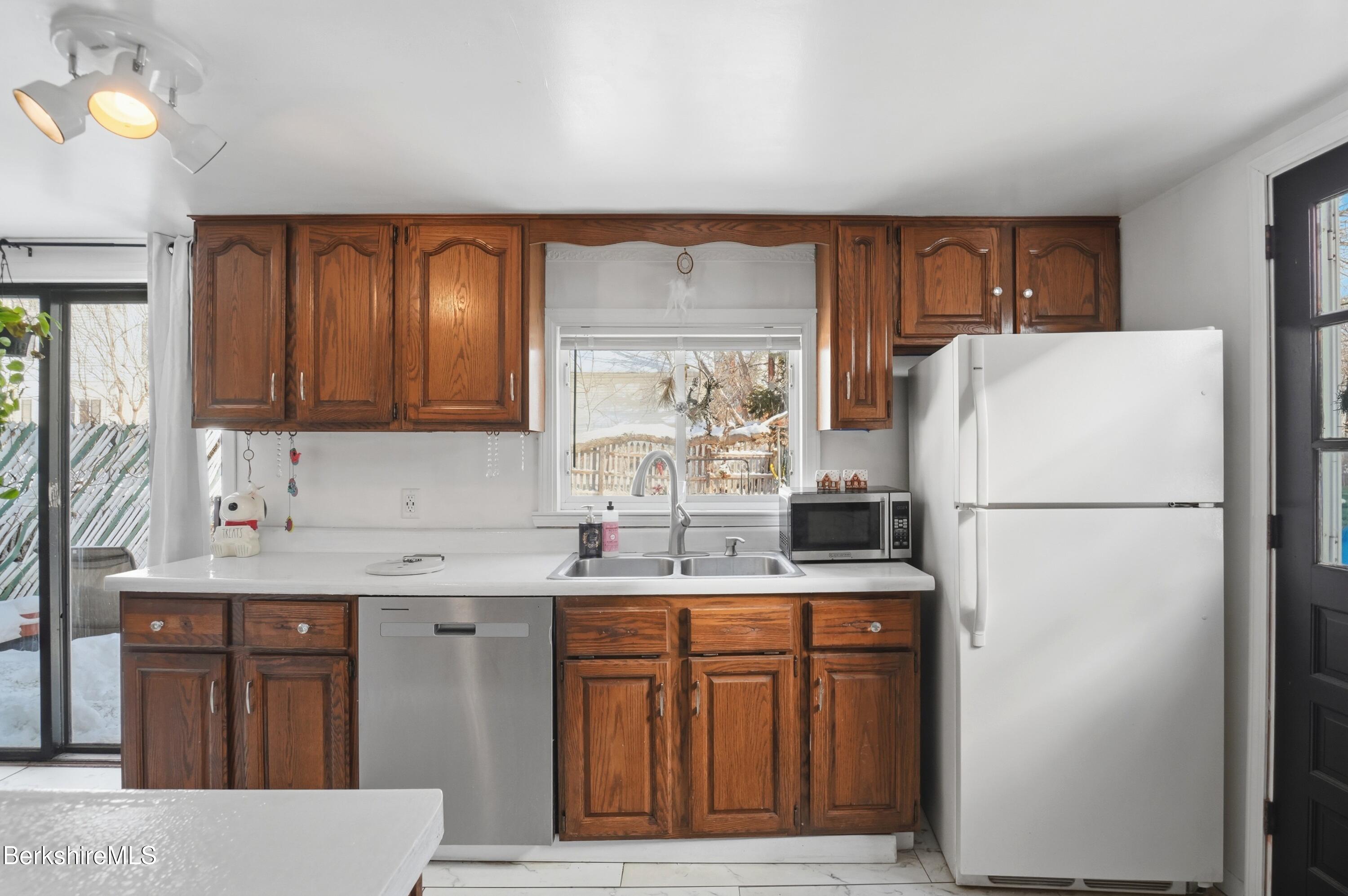 9 Lincoln Street Pittsfield, MA 01201 - Photo 9 of 44 a kitchen with stainless steel appliances a refrigerator and a sink