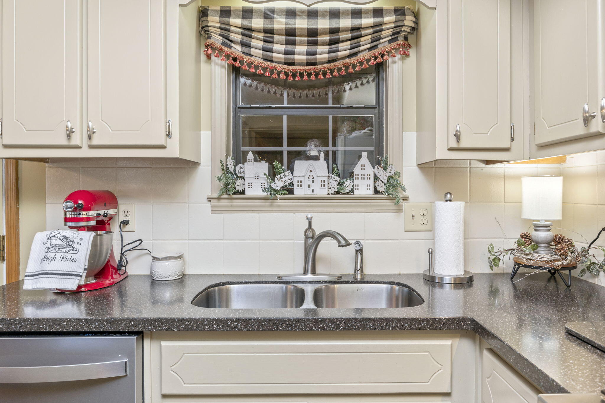 5811 Dairy Road Baker, FL 32531 - Photo 12 of 36 a kitchen with granite countertop a sink and cabinets