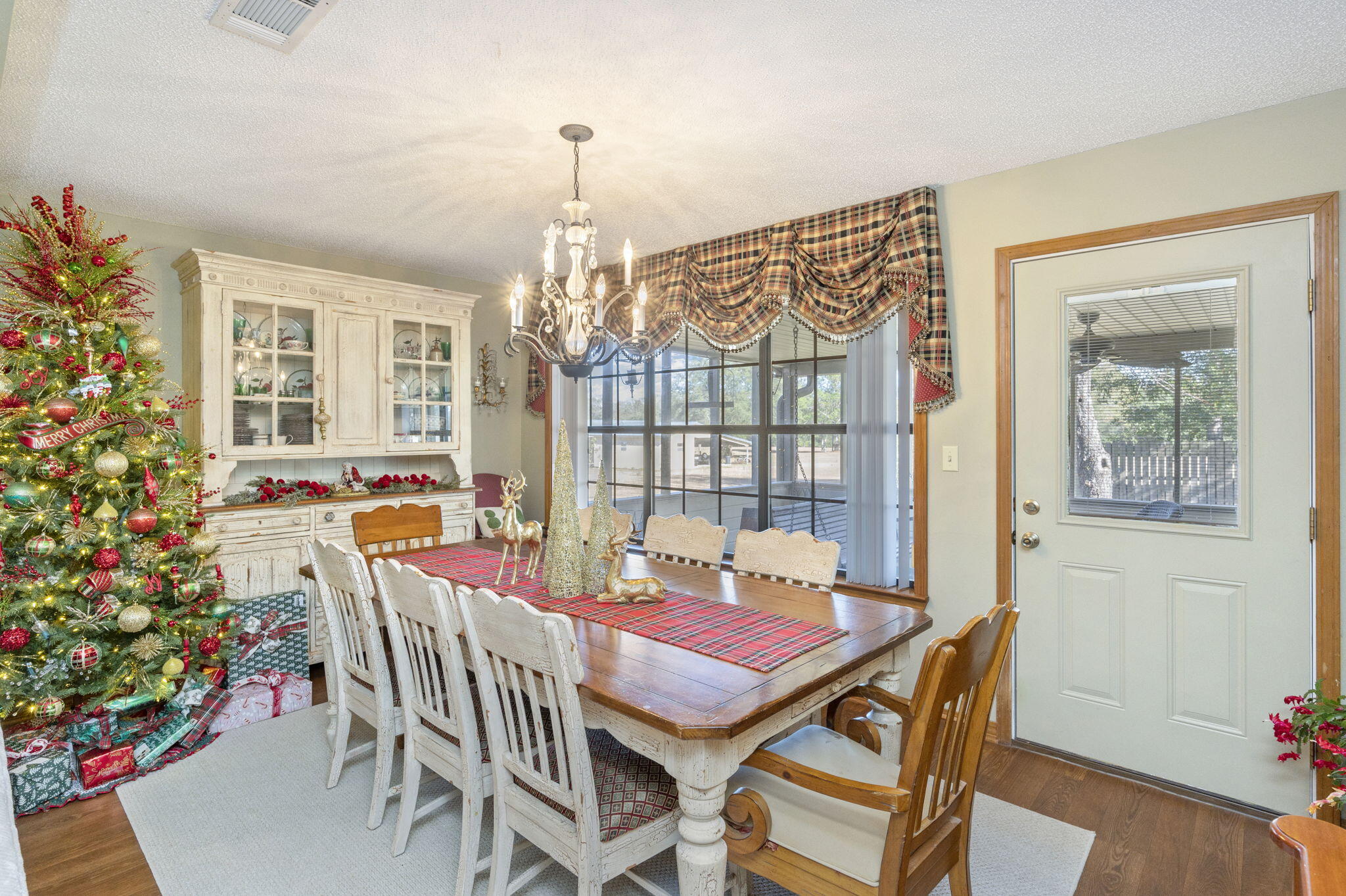 5811 Dairy Road Baker, FL 32531 - Photo 16 of 36 a view of a dining room with furniture window and wooden floor