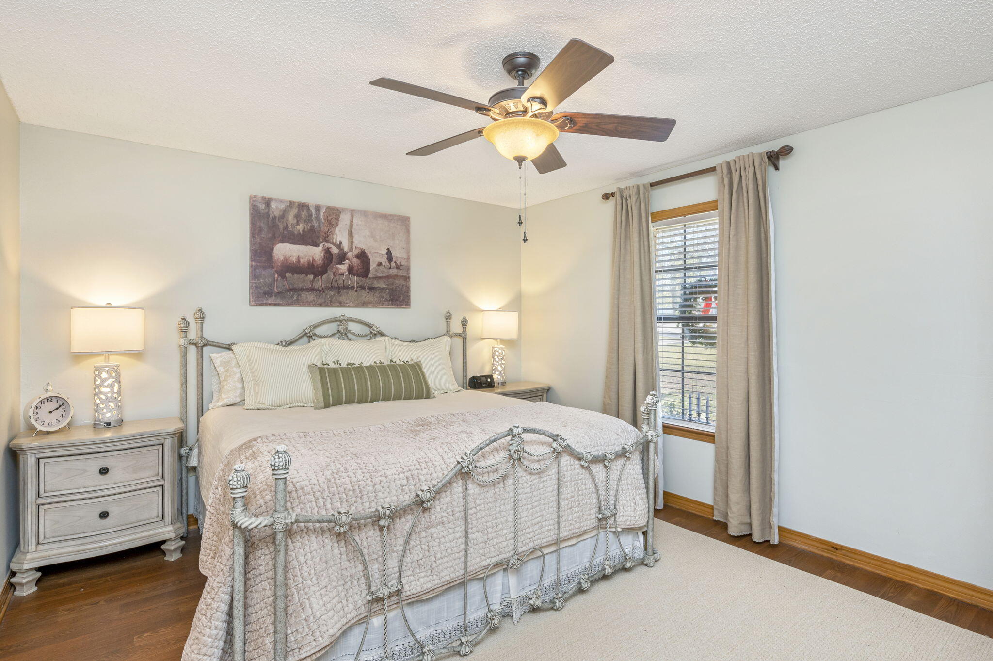5811 Dairy Road Baker, FL 32531 - Photo 17 of 36 a bedroom with a bed and a chandelier