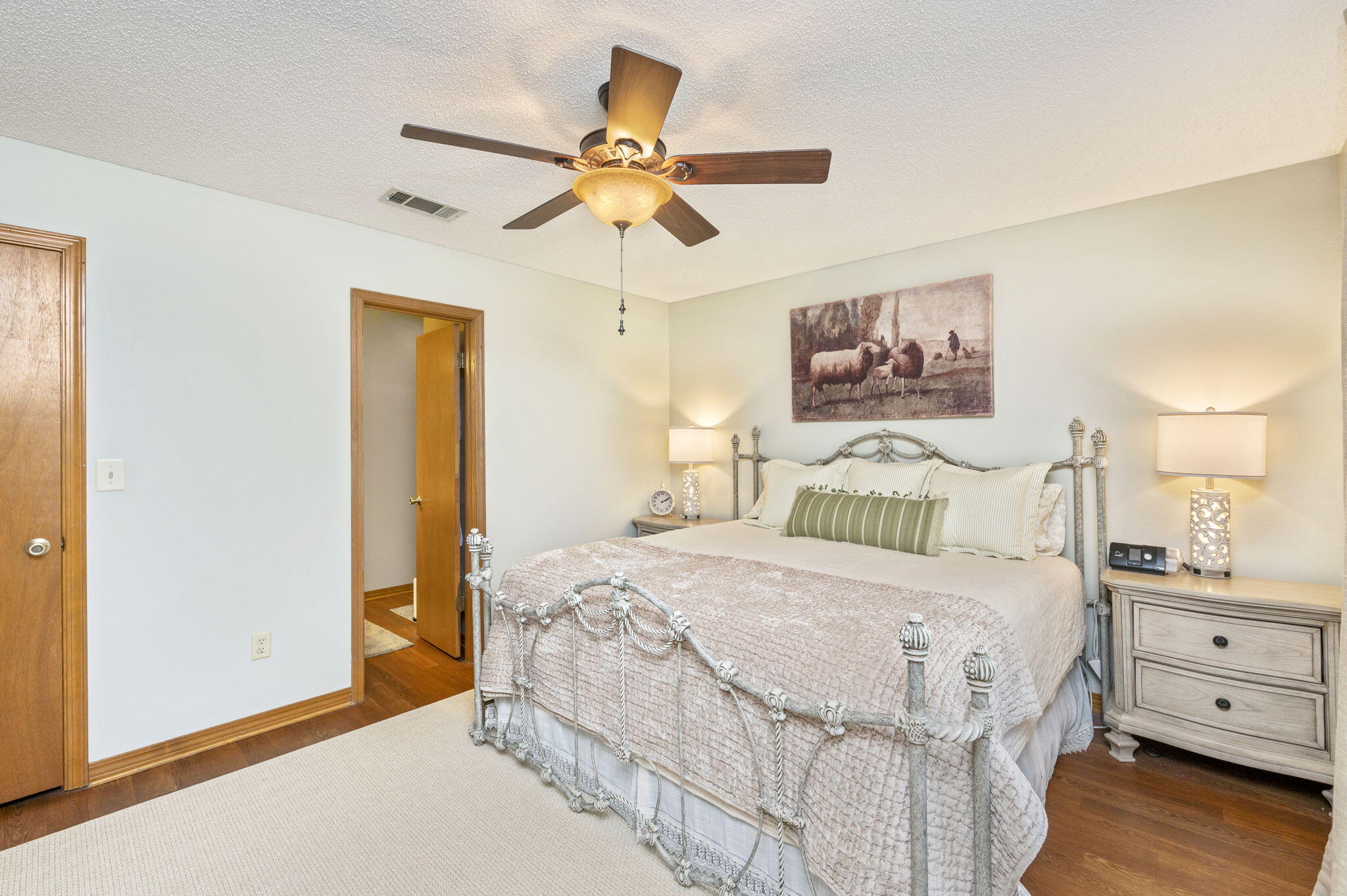5811 Dairy Road Baker, FL 32531 - Photo 18 of 36 a bedroom with a bed and a chandelier