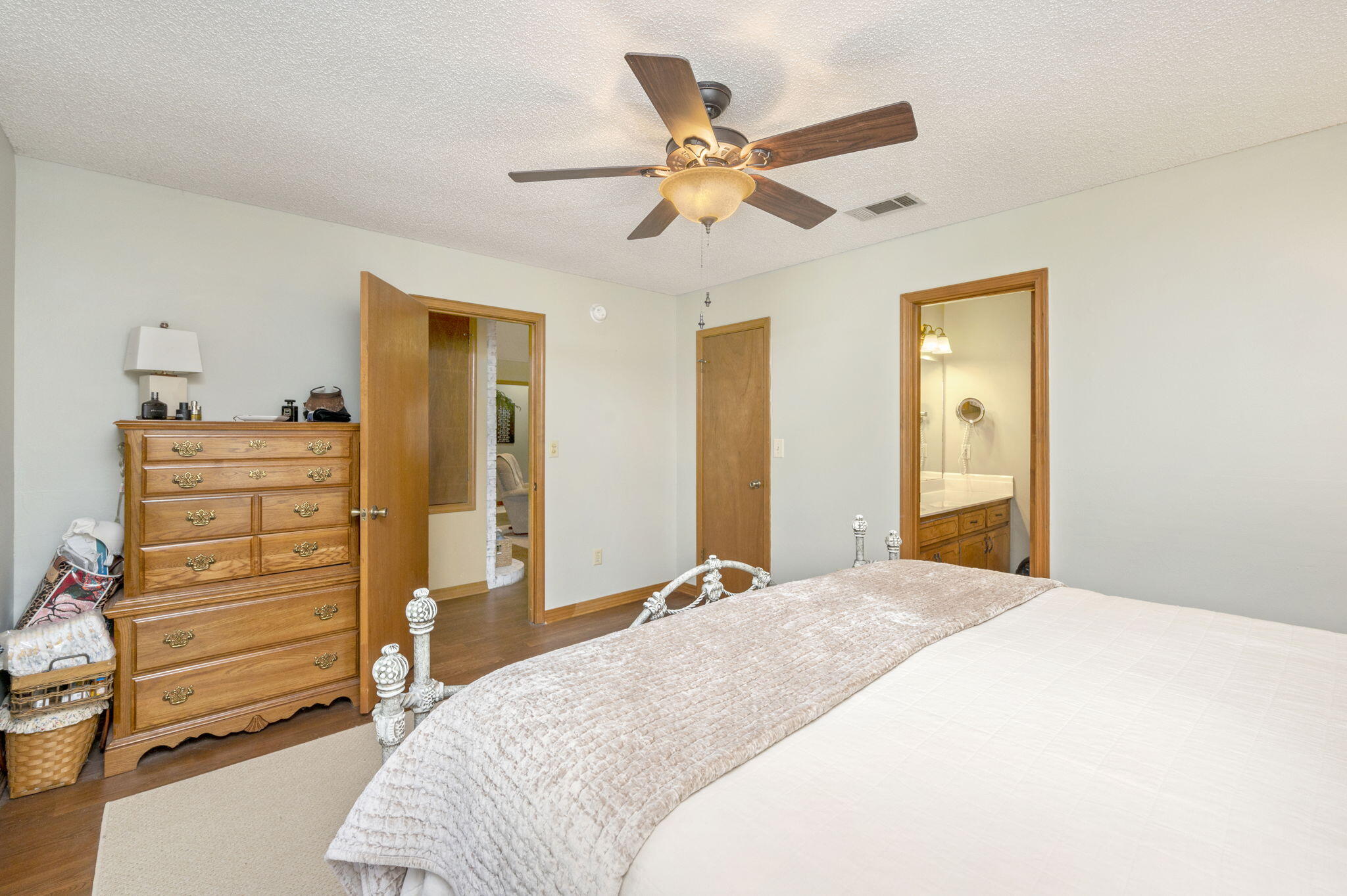 5811 Dairy Road Baker, FL 32531 - Photo 19 of 36 a bedroom with a bed and a chandelier
