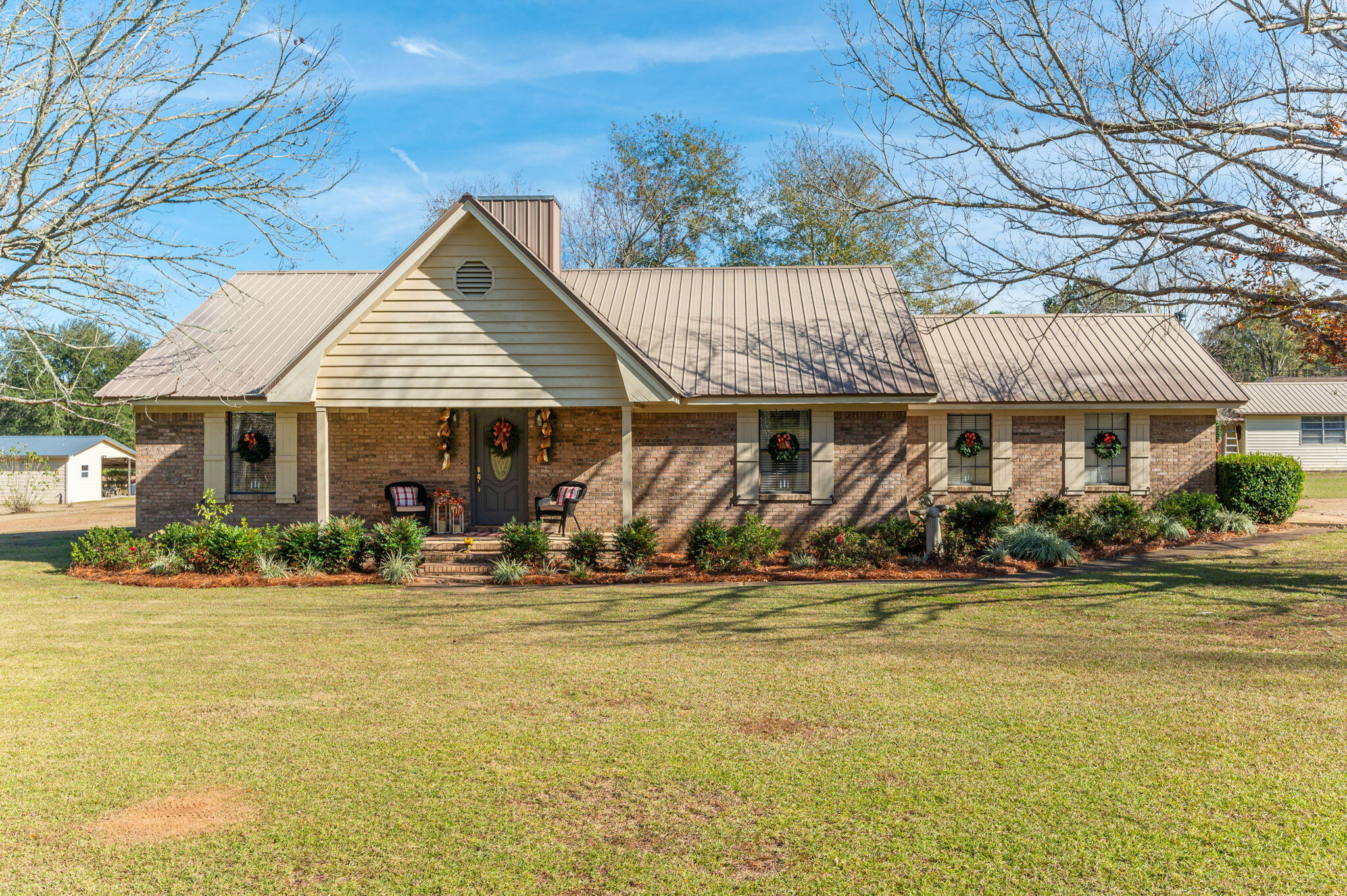 5811 Dairy Road Baker, FL 32531 - Photo 2 of 36 a front view of a house with swimming pool and porch
