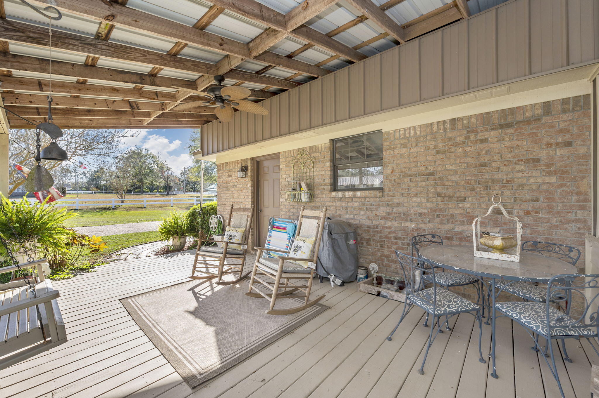 5811 Dairy Road Baker, FL 32531 - Photo 28 of 36 a view of a patio with table and chairs and potted plants