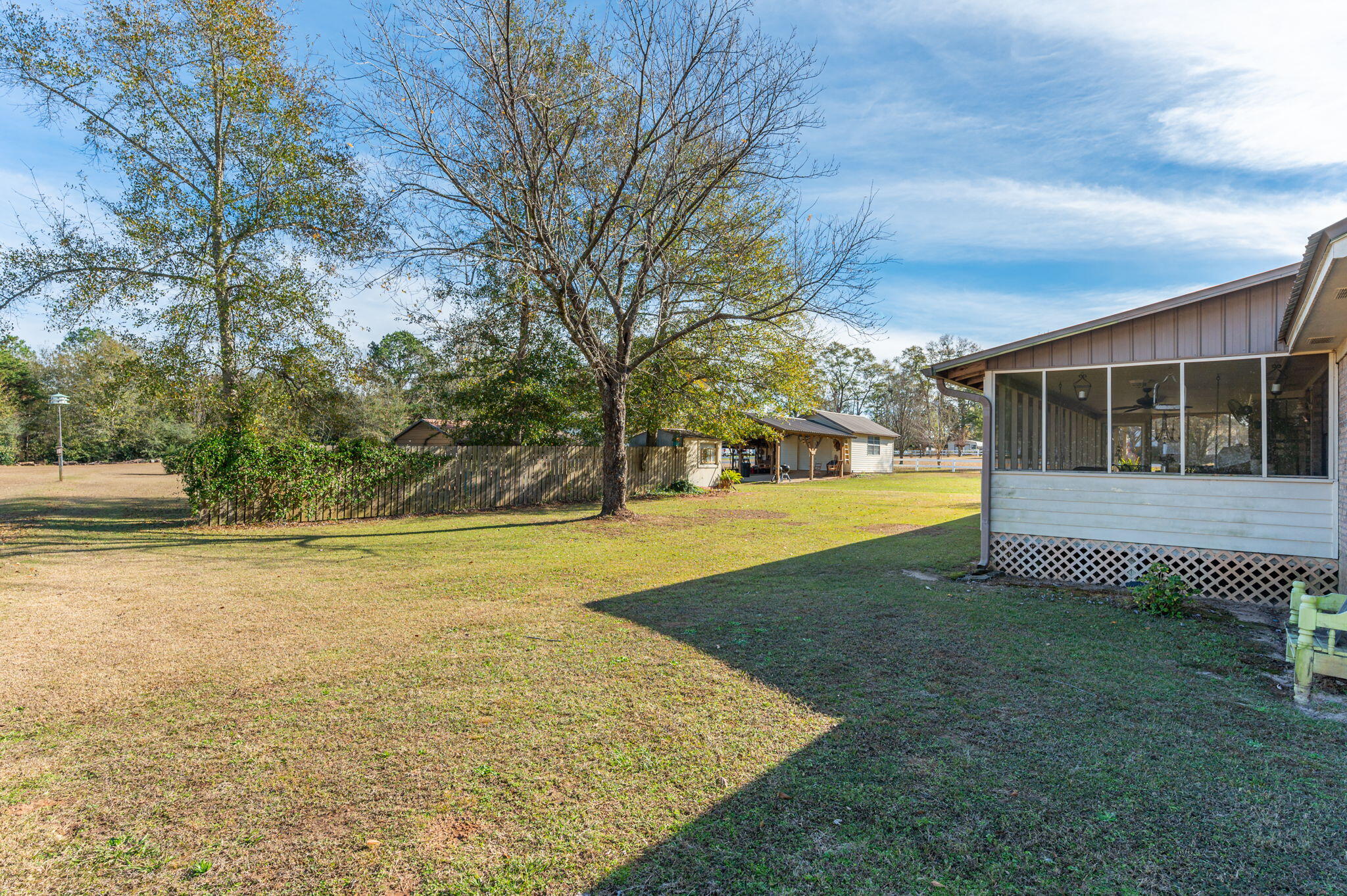 5811 Dairy Road Baker, FL 32531 - Photo 35 of 36 a view of a house with yard and sitting area