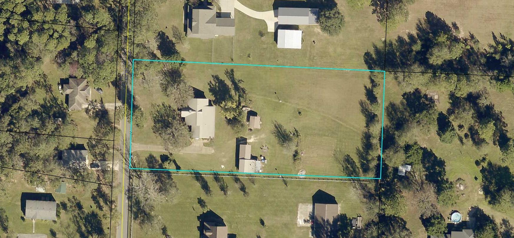 5811 Dairy Road Baker, FL 32531 - Photo 36 of 36 an aerial view of a house with a yard