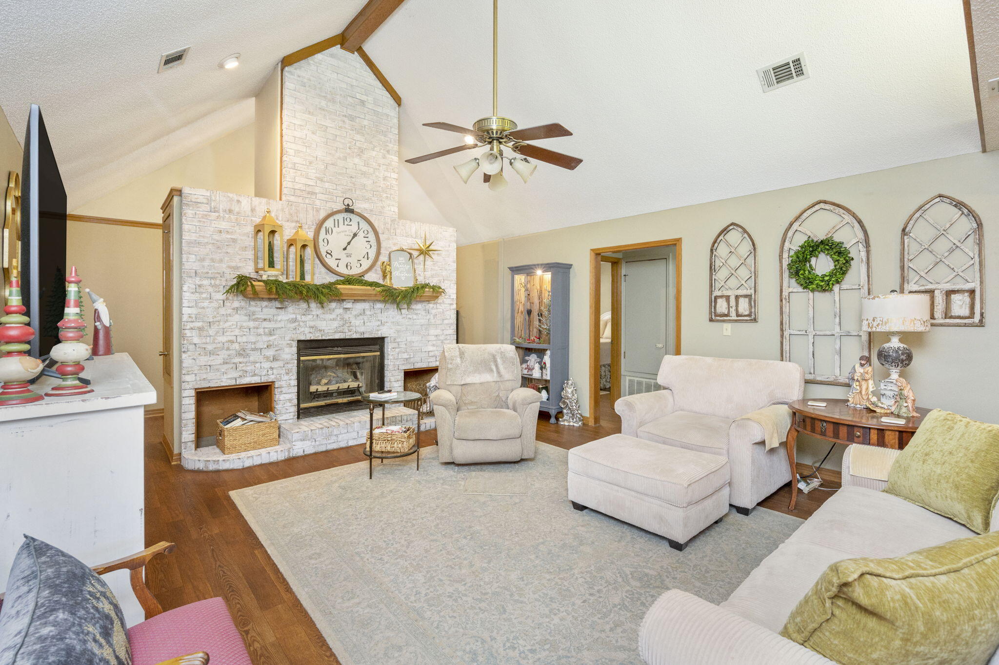 5811 Dairy Road Baker, FL 32531 - Photo 5 of 36 a living room with furniture a fireplace and a large window