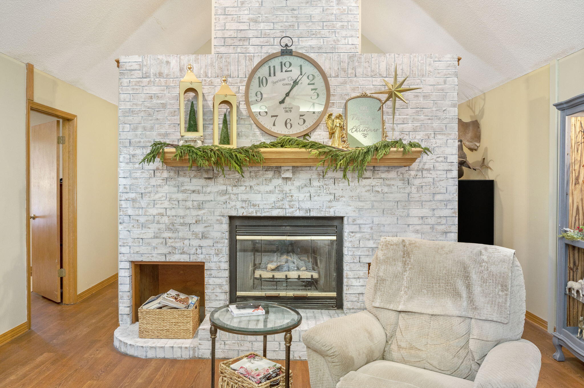 5811 Dairy Road Baker, FL 32531 - Photo 8 of 36 a living room with furniture a fireplace and a wall painting