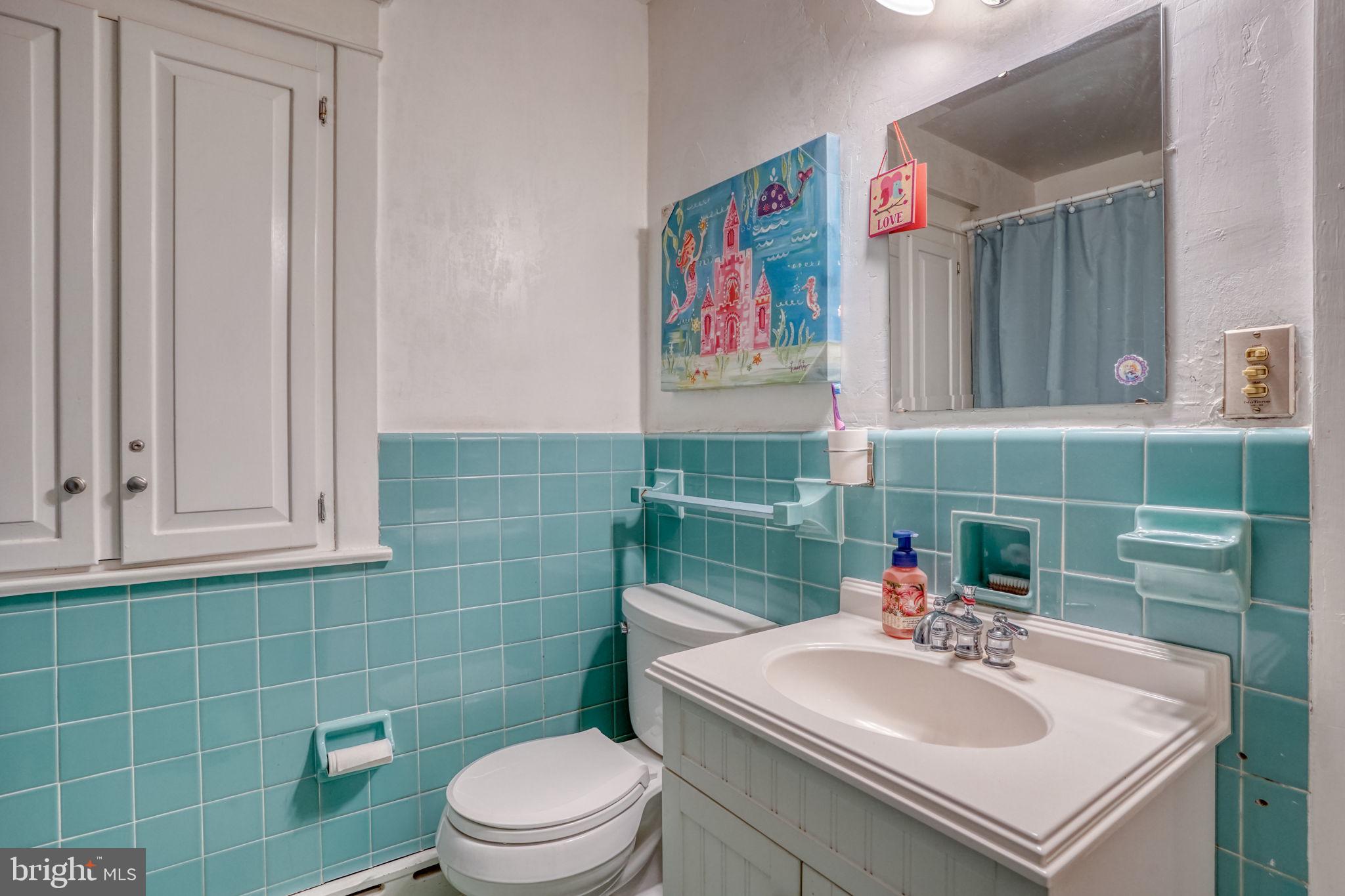 20 Rodney Road Dover, DE 19901 - Photo 50 of 58 a bathroom with a sink toilet and a mirror