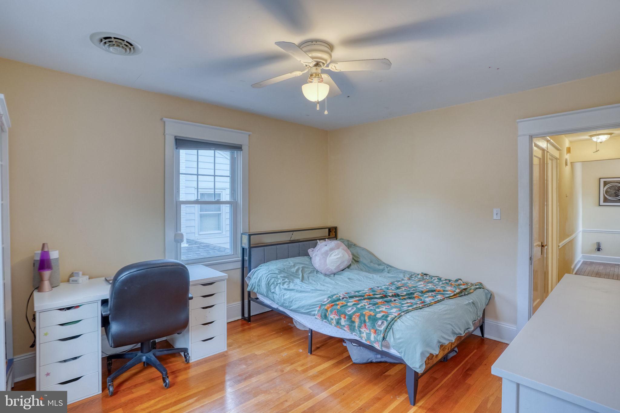 20 Rodney Road Dover, DE 19901 - Photo 54 of 58 a bedroom with a bed and a chandelier