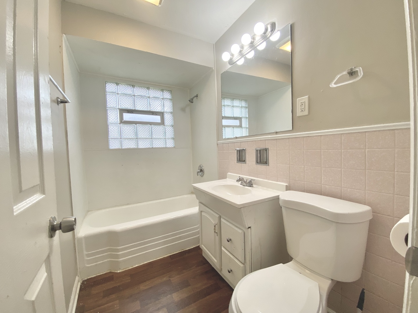 18747 Sherman Street Lansing, IL 60438 - Photo 15 of 20 a bathroom with a toilet sink and mirror