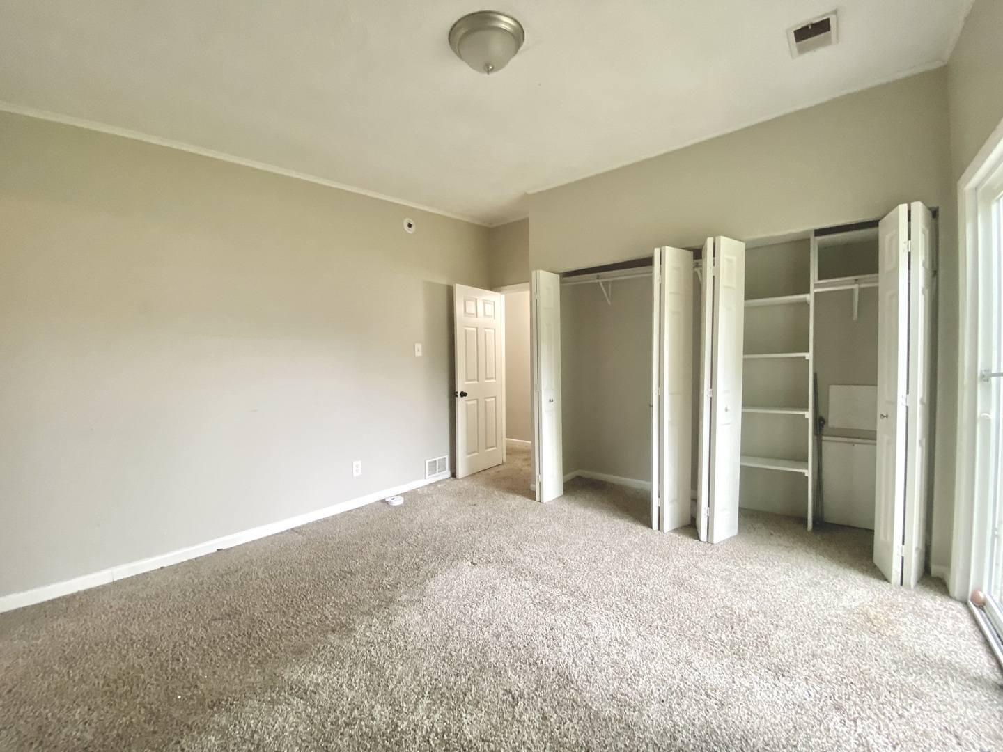18747 Sherman Street Lansing, IL 60438 - Photo 18 of 20 an empty room with closet and a window
