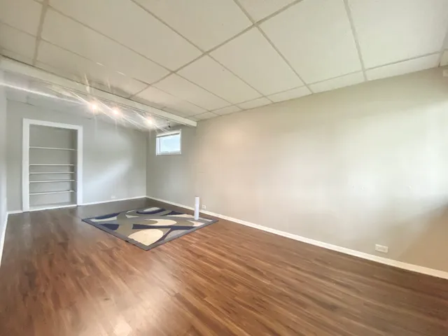 a view of a livingroom with wooden floor