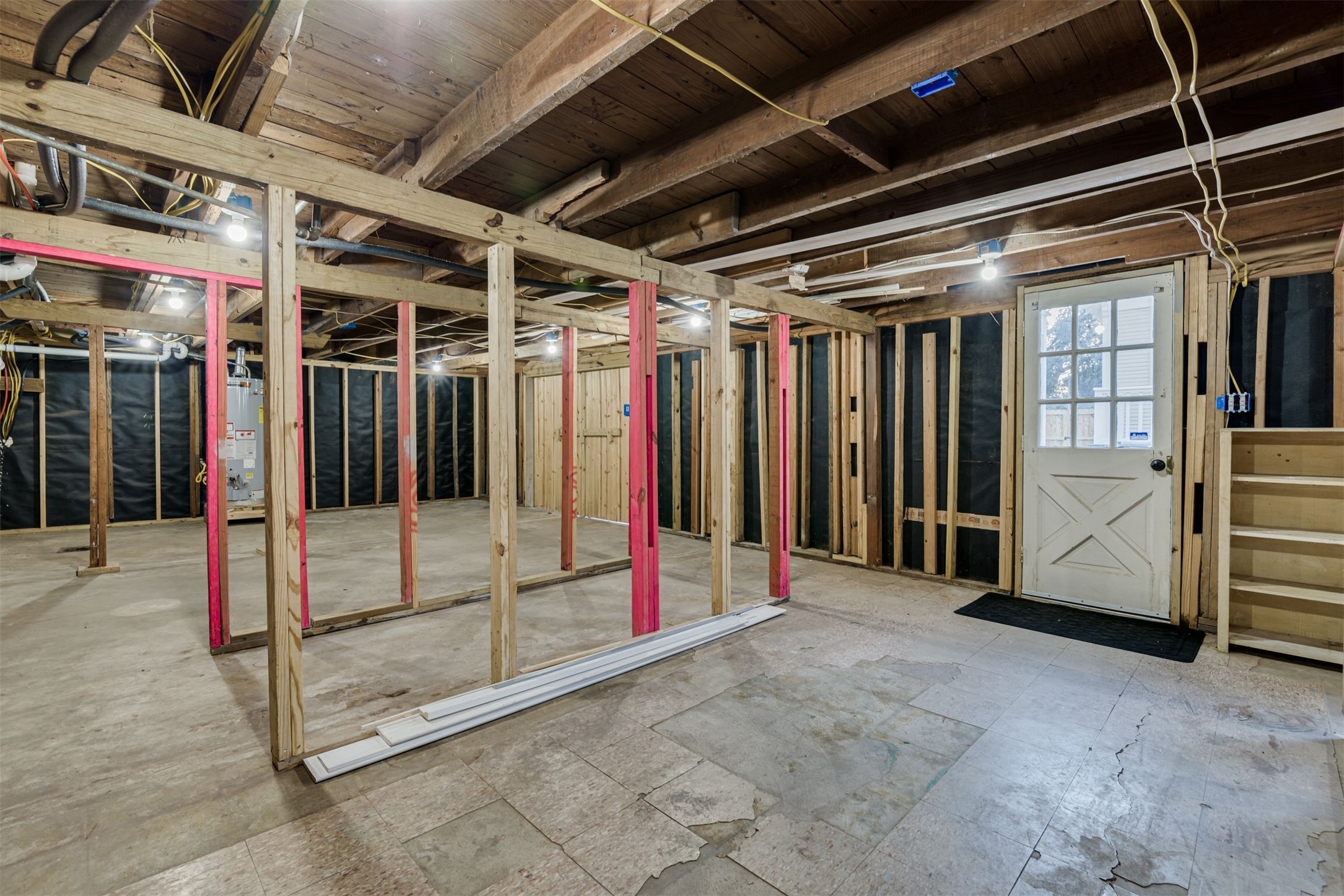 4618 McEwen Street Houston, TX 77009 - Photo 33 of 39 Located underneath the garage apartment, you will find approx. 800 SF of additional framed out space. This area can be used for storage as-is, or easily finished out for additional conditioned space.