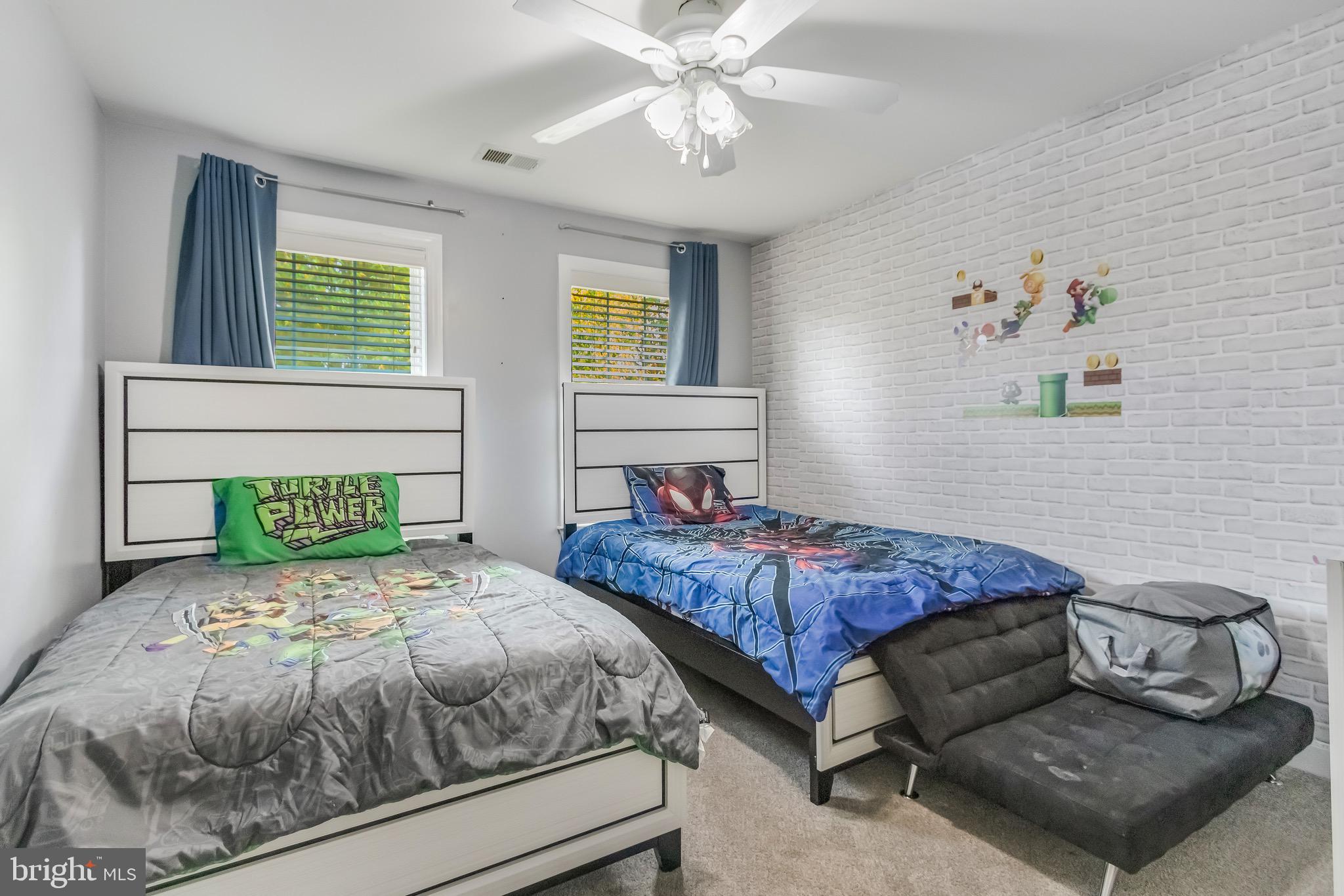 16607 Mannington Road Accokeek, MD 20607 - Photo 18 of 32 a bedroom with a bed and ceiling fan