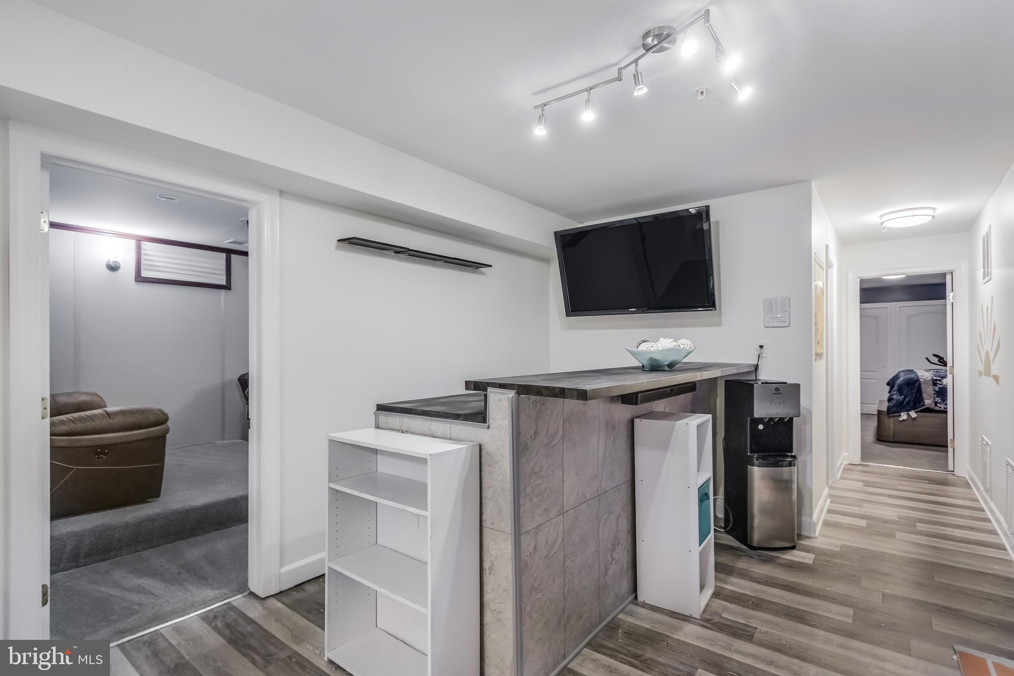 16607 Mannington Road Accokeek, MD 20607 - Photo 23 of 32 a view of a livingroom with wooden floor and a flat screen tv