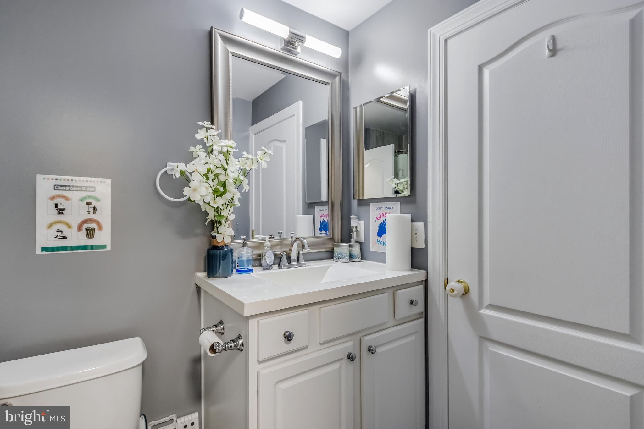 16607 Mannington Road Accokeek, MD 20607 - Photo 25 of 32 a bathroom with a sink vanity granite and toilet
