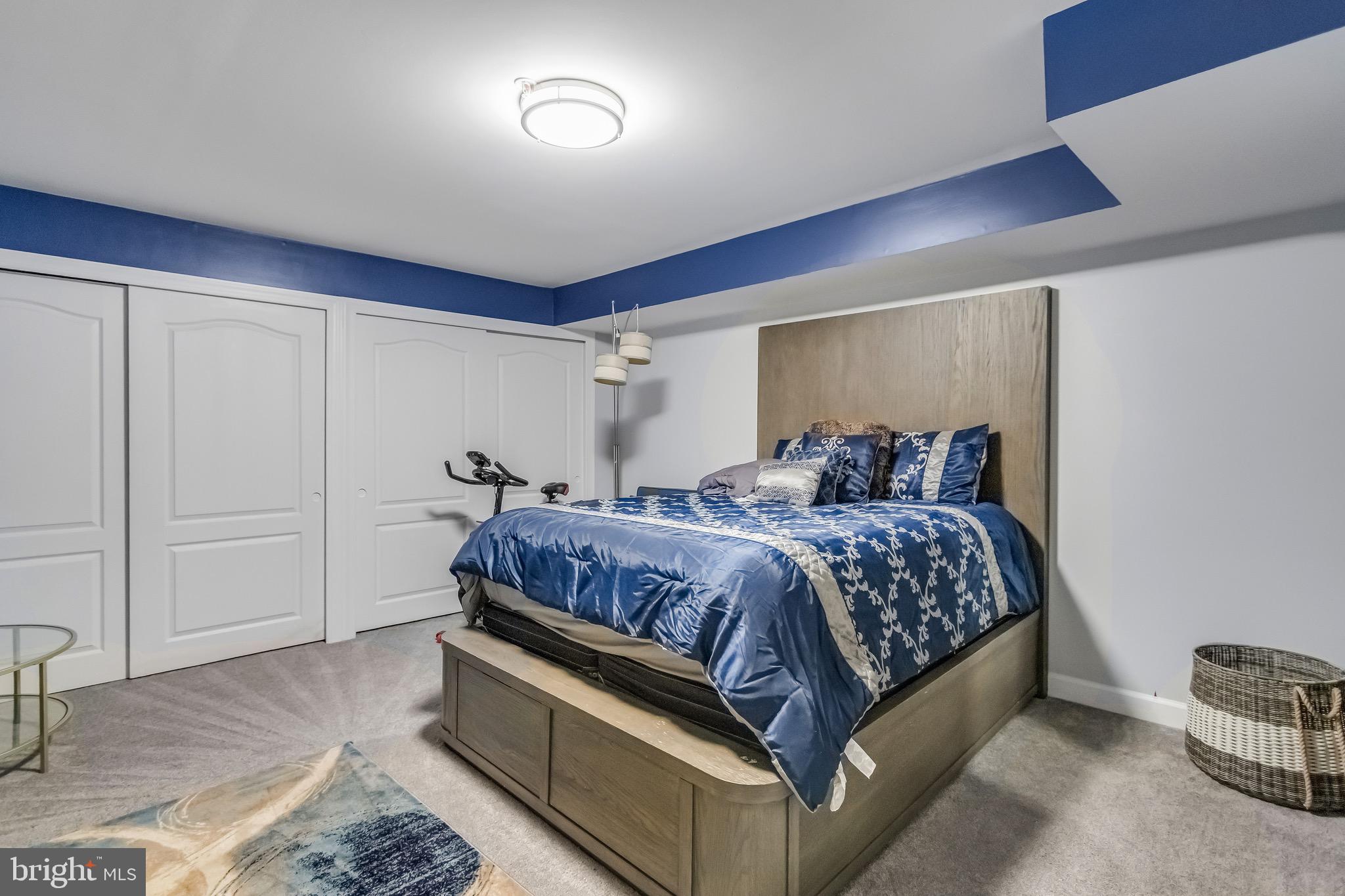 16607 Mannington Road Accokeek, MD 20607 - Photo 26 of 32 a bedroom with a bed and lamp