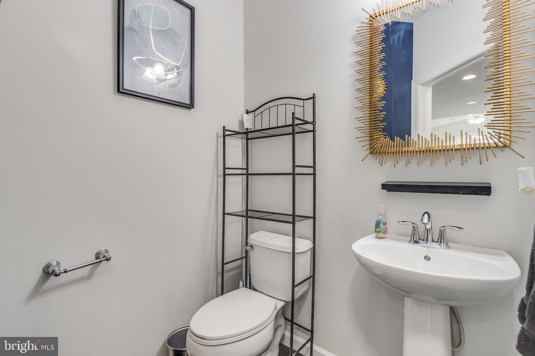 16607 Mannington Road Accokeek, MD 20607 - Photo 29 of 32 a bathroom with a sink mirror and toilet