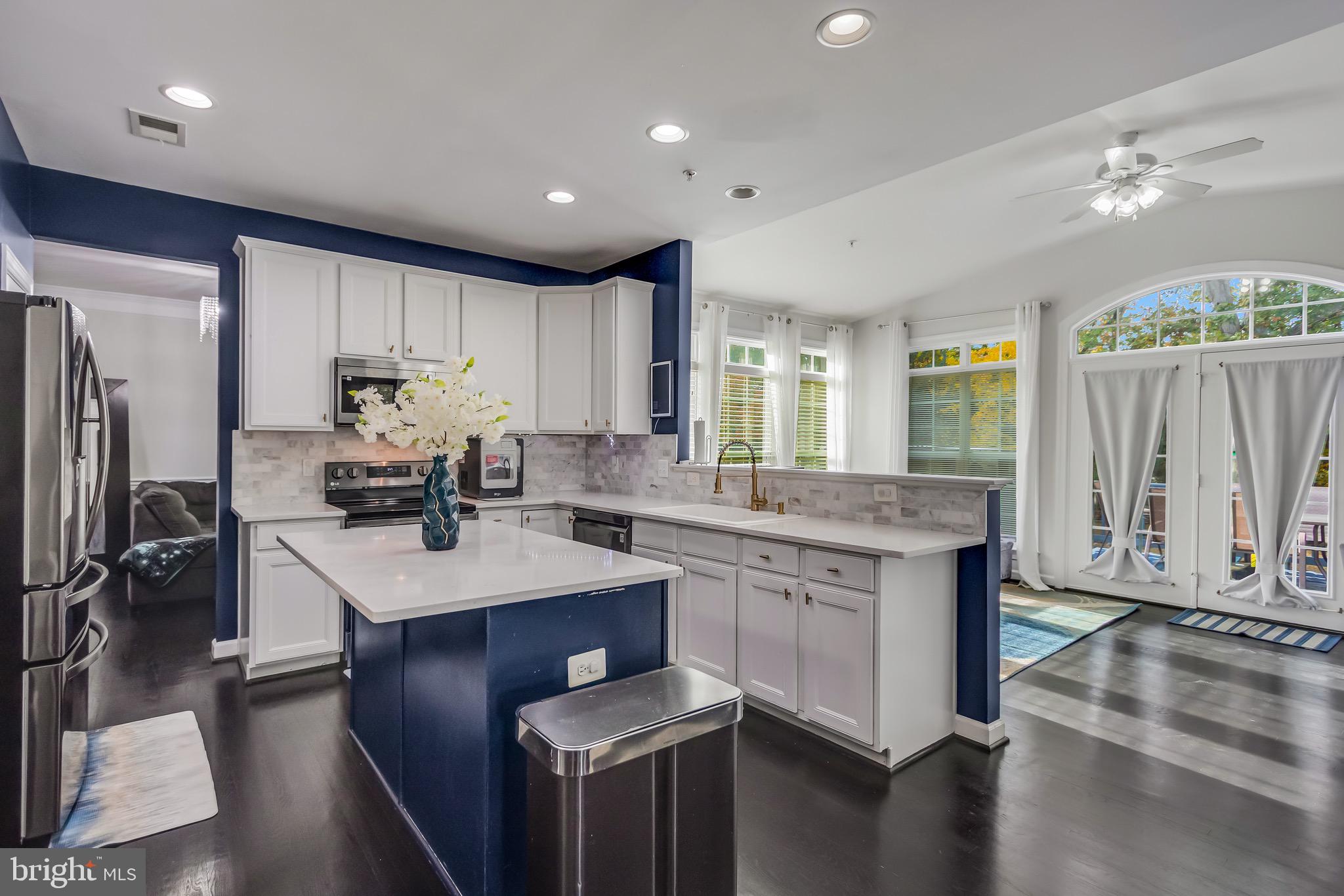 16607 Mannington Road Accokeek, MD 20607 - Photo 4 of 32 a kitchen with stainless steel appliances granite countertop a sink stove and refrigerator