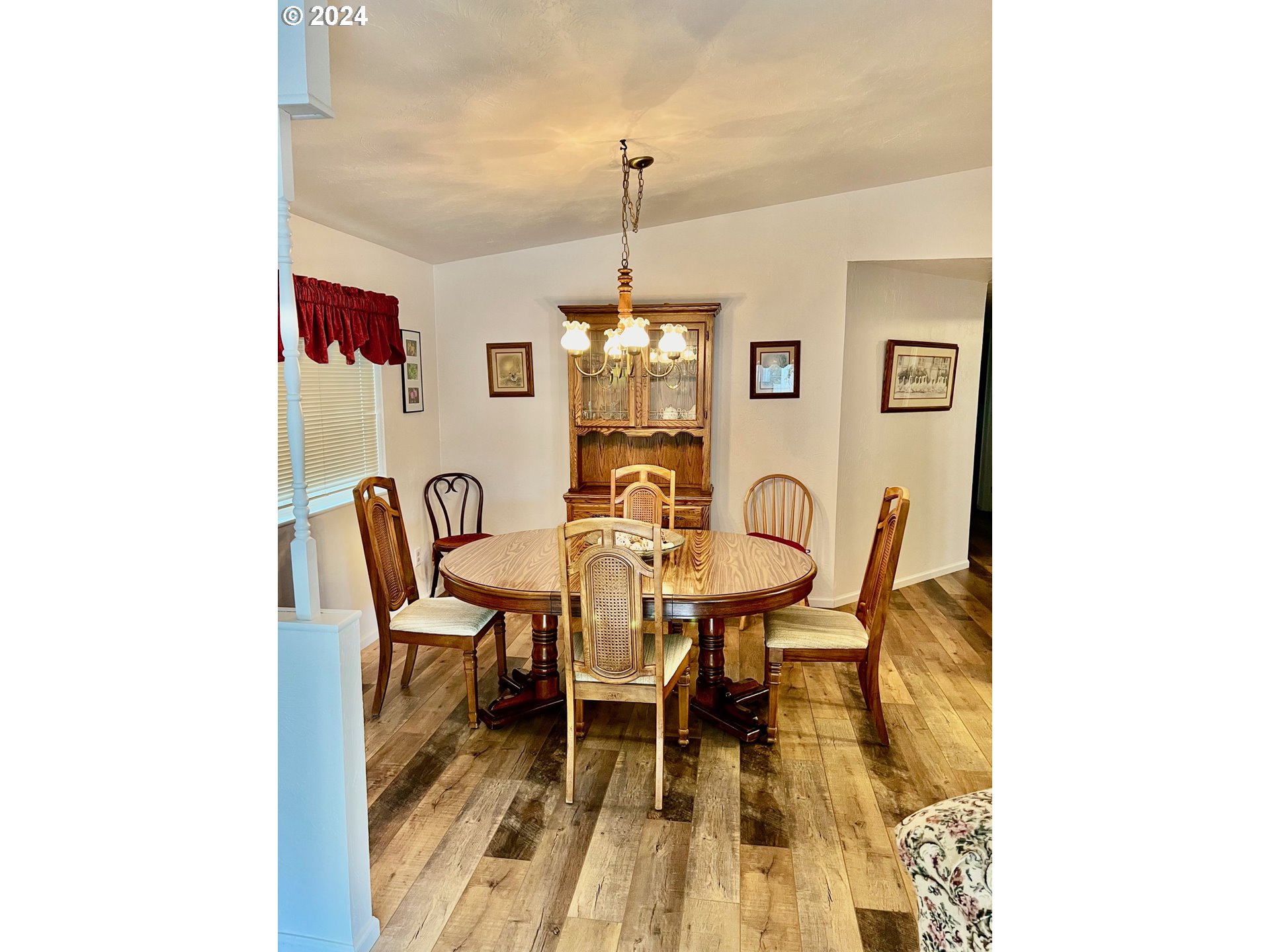 1601 Rhododendron Drive, Unit 694 Florence, OR 97439 - Photo 11 of 32 a view of a dining room with furniture and window
