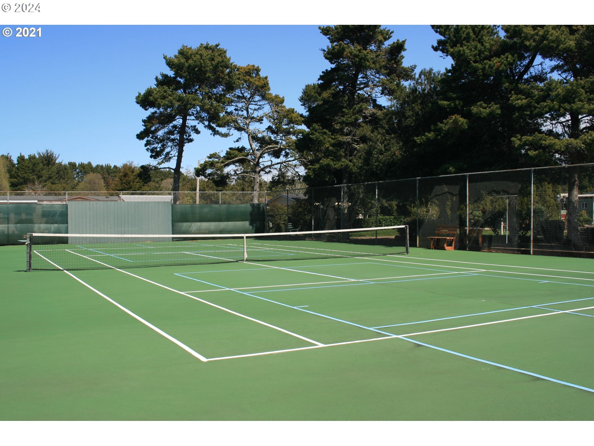 1601 Rhododendron Drive, Unit 694 Florence, OR 97439 - Photo 28 of 32 a view of a tennis court
