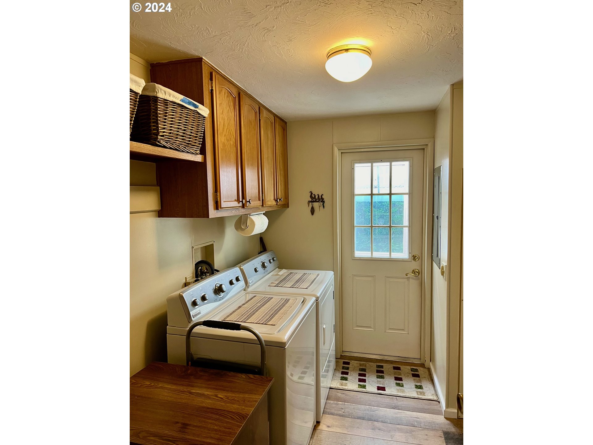 1601 Rhododendron Drive, Unit 694 Florence, OR 97439 - Photo 5 of 32 a utility room with dryer and washer