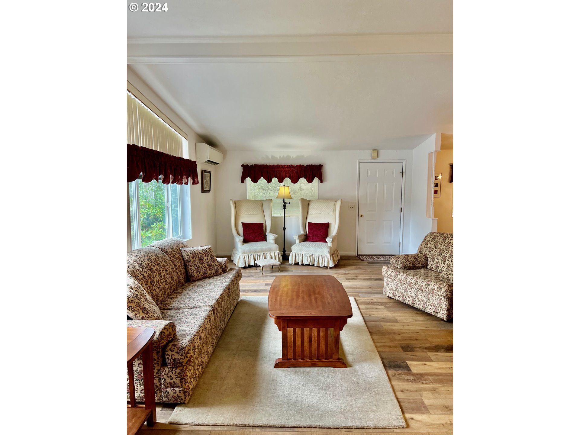 1601 Rhododendron Drive, Unit 694 Florence, OR 97439 - Photo 8 of 32 a living room with furniture and a fireplace