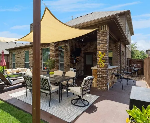 a building outdoor space with patio furniture and potted plants