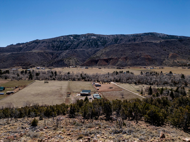 8094 West Red Cloud Loop Road Vernal, UT 84078 - Photo 12 of 35 View of mountain backdrop with rural landscape looking Southward