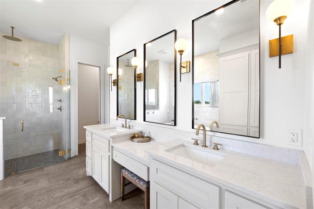 861 Brindley Road Maypearl, TX 76064 - Photo 29 of 36 Dual vanity with white cabinetry, light-toned countertops, and gold-finish fixtures