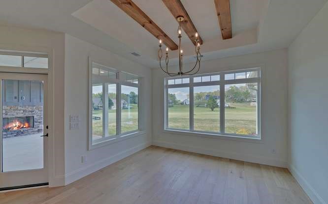 317 Bell Creek Cove Road Hiawassee, GA 30546 - Photo 17 of 74 a view of an empty room with wooden floor and a window
