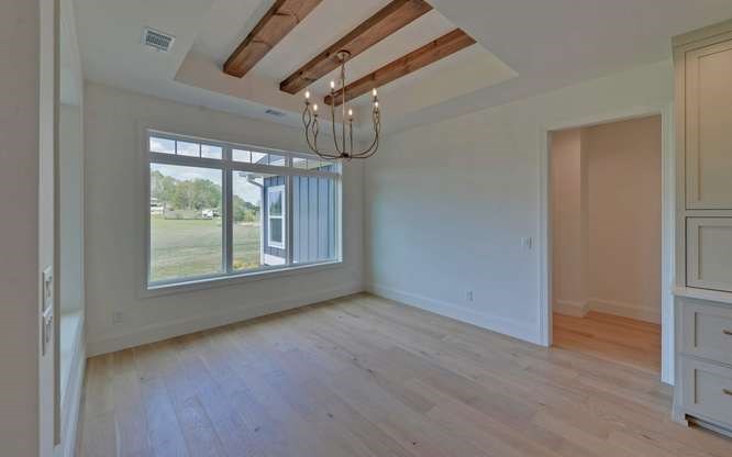 317 Bell Creek Cove Road Hiawassee, GA 30546 - Photo 18 of 74 a view of an empty room with wooden floor fan and window