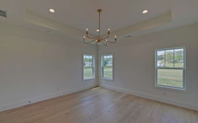 317 Bell Creek Cove Road Hiawassee, GA 30546 - Photo 22 of 74 an empty room that has a window and ceiling fan