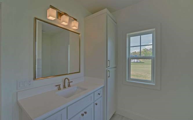 317 Bell Creek Cove Road Hiawassee, GA 30546 - Photo 23 of 74 a bathroom with a sink and a mirror