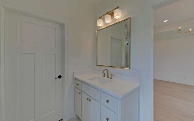 317 Bell Creek Cove Road Hiawassee, GA 30546 - Photo 25 of 74 a bathroom with 2 sink and a mirror